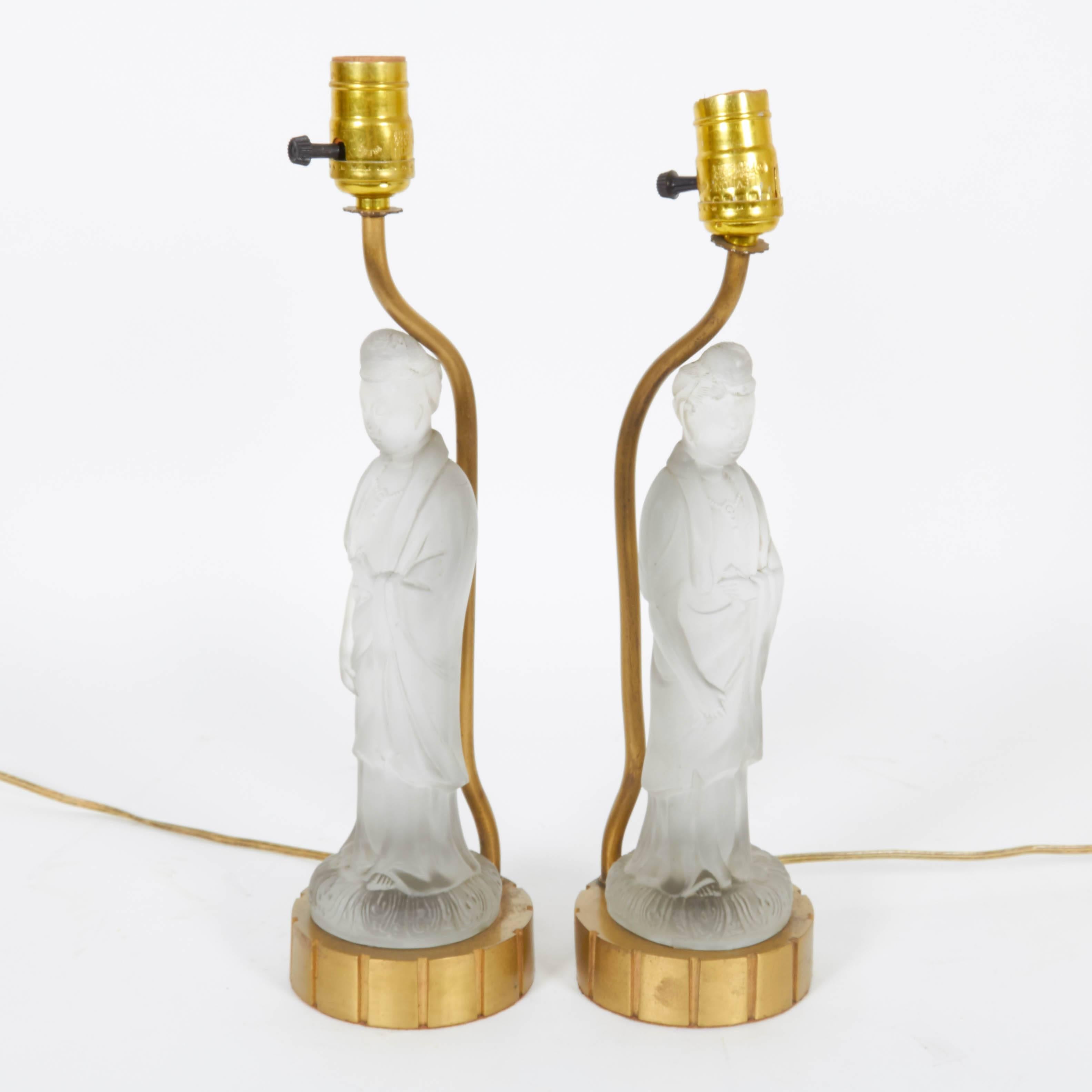 A pair of circa 1920s figural table lamps, each featuring a satin glass Quan Yin mounted on brass base. Very good vintage condition, with some wear to sockets; includes original wiring.

11063
