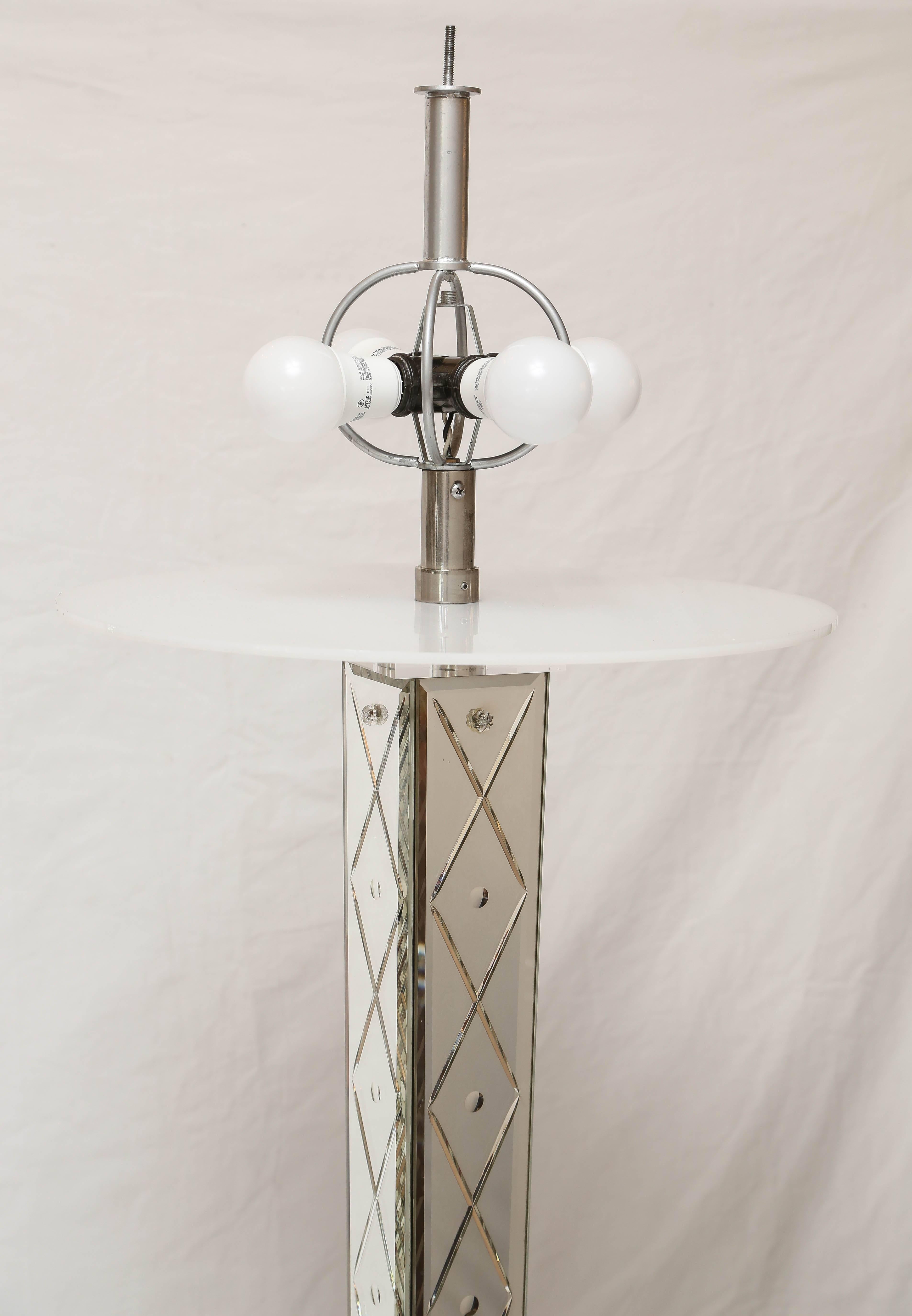 Custom designed by Philippe Starck for the Delano hotel on Miami Beach in 1985. The stem has mirrored panels with glass etched flowers and the original custom heavy steel shade with diamond cut pattern. This is a unique piece created for an iconic