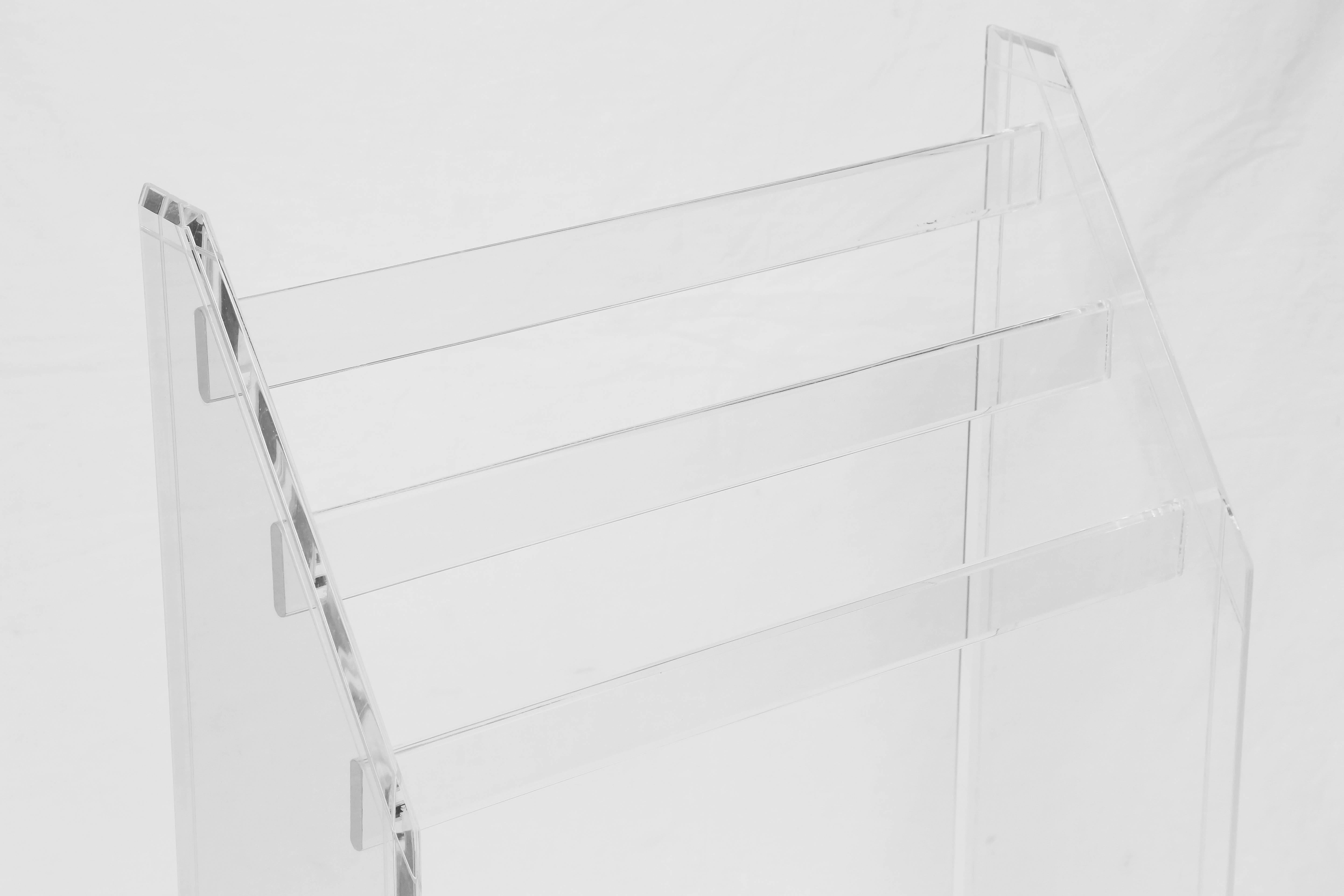 Three-tier Mid-Century Modern Lucite rack for towels or bedspreads.
This item is as functional as stylish.