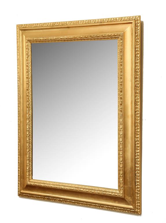 Gilded mirror with fine detailing in the frame, made in Italy.