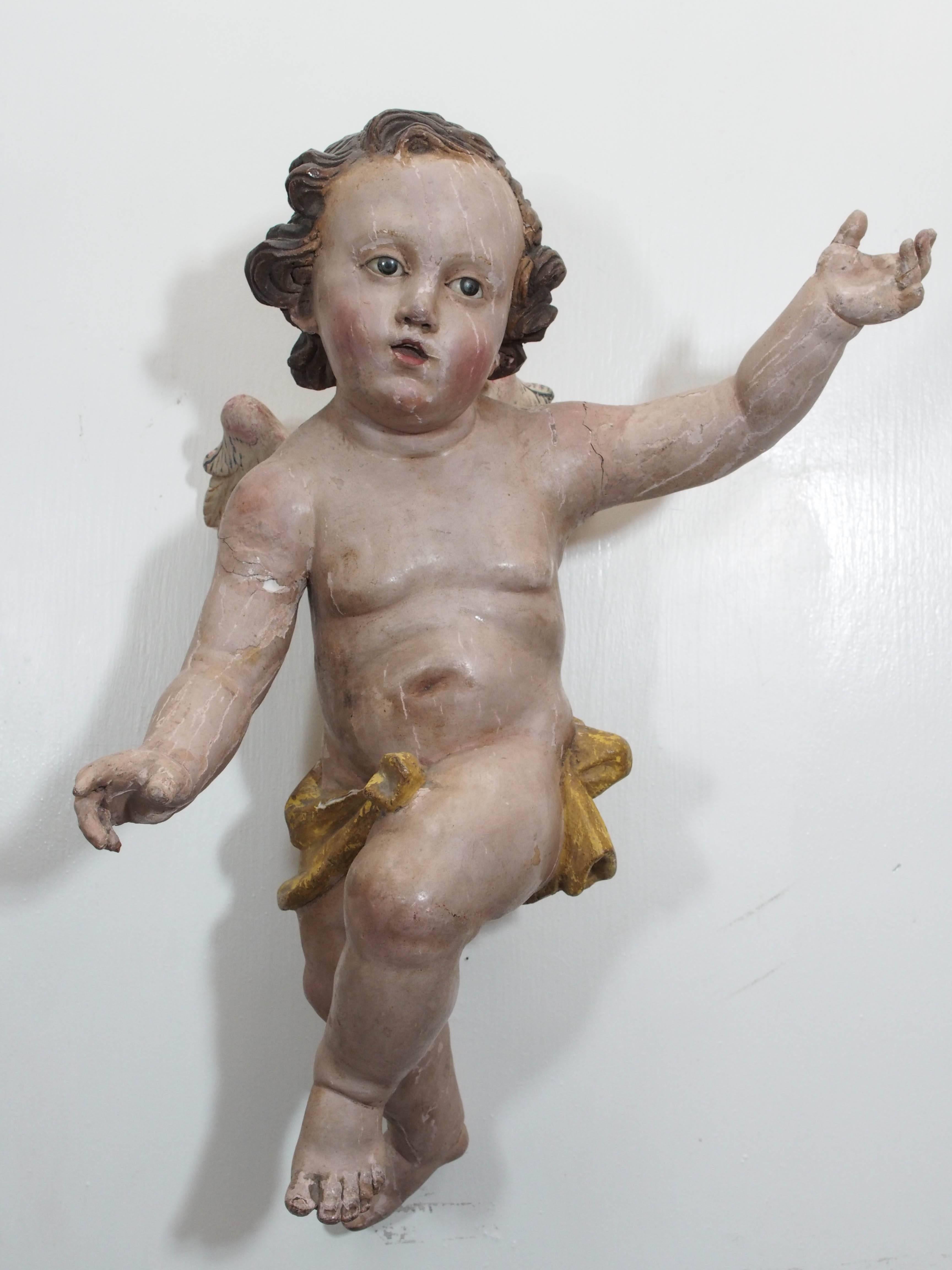 Pair of Italian polychromed Cherubs with glass eyes.