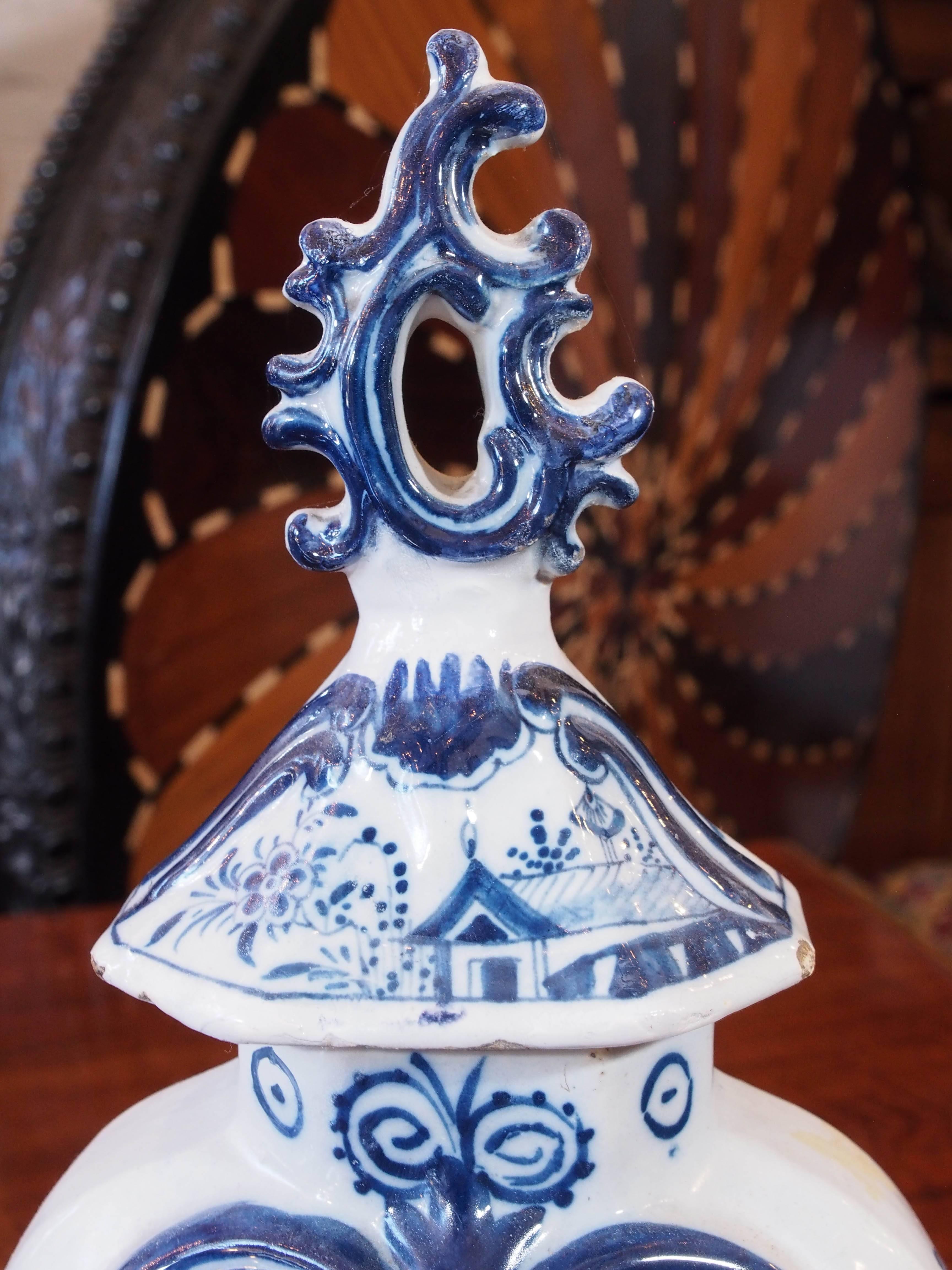Dutch Pair of Delft Blue and White Lidded Garniture Vases