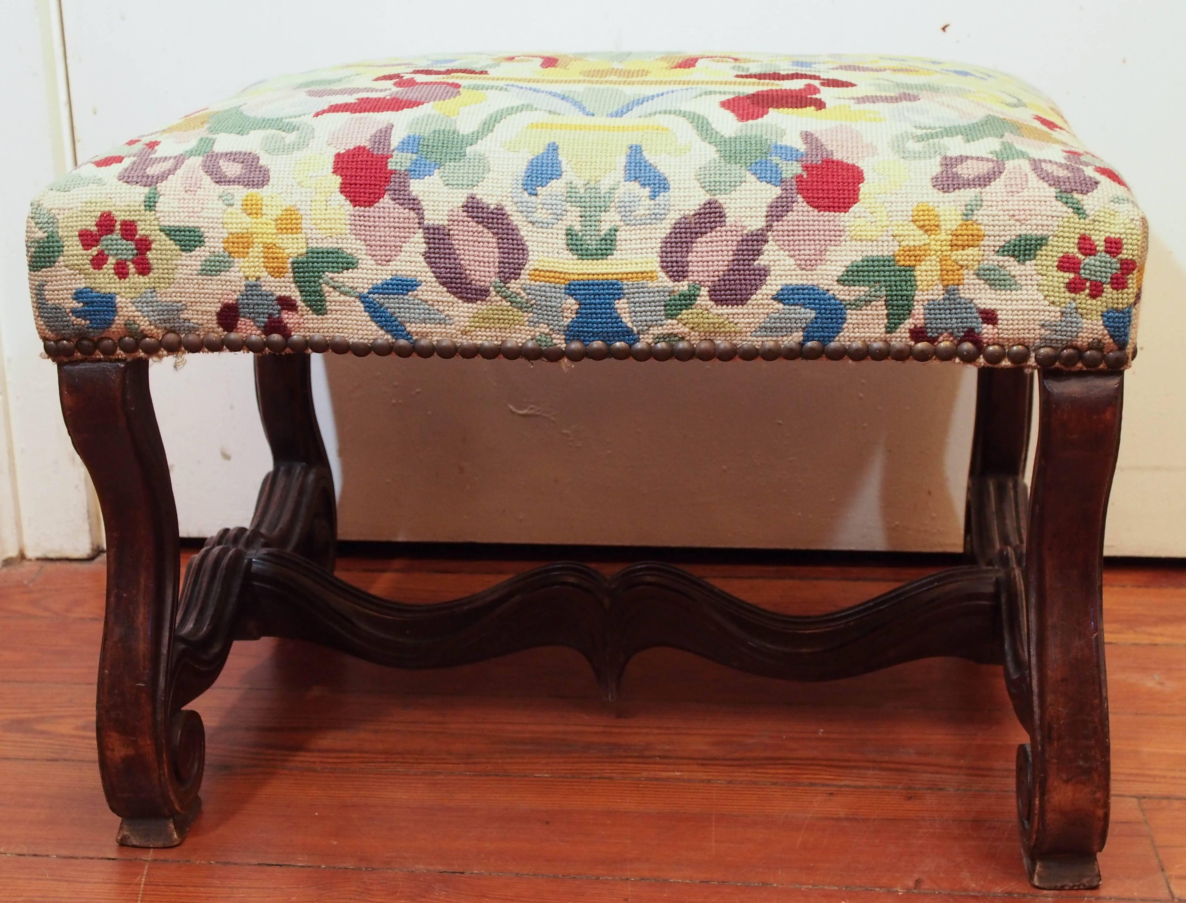 French walnut Os De Mouton (lambs bone) stool with needlepoint cover.