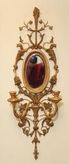 Pair of Italian Gilded Iron and Wood Foliate Sconces with Mirror Backplate