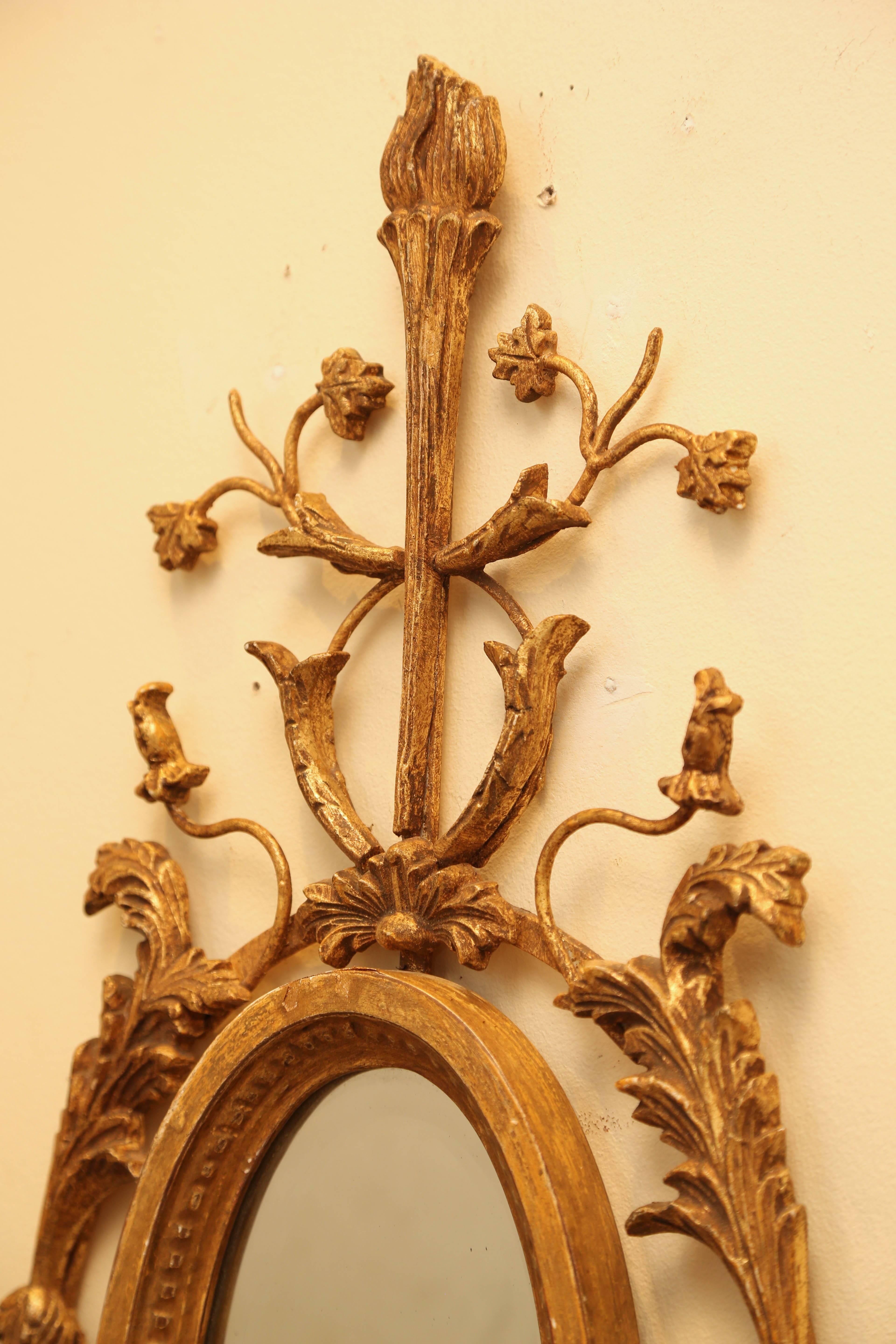 Carved Pair of Italian Gilded Iron and Wood Foliate Sconces with Mirror Backplate