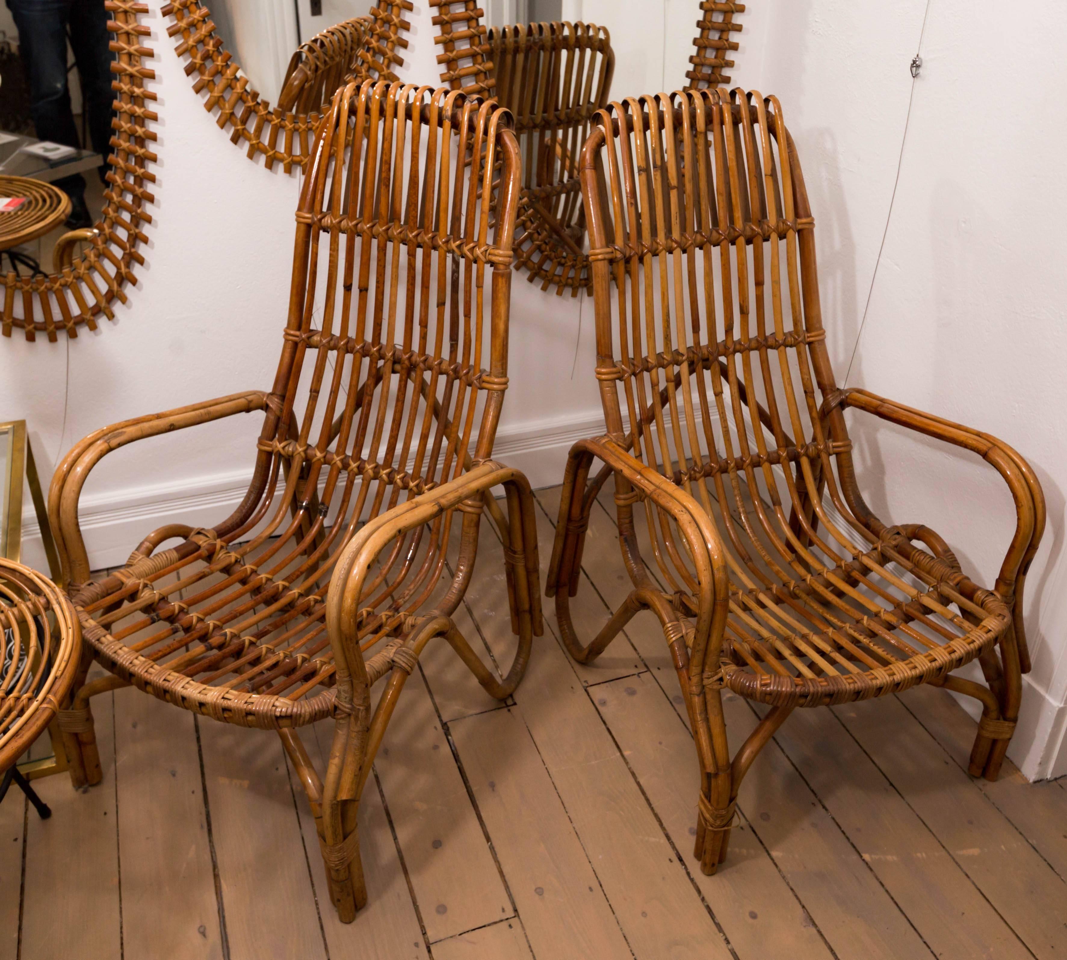 Pair of tall back rattan armchairs.