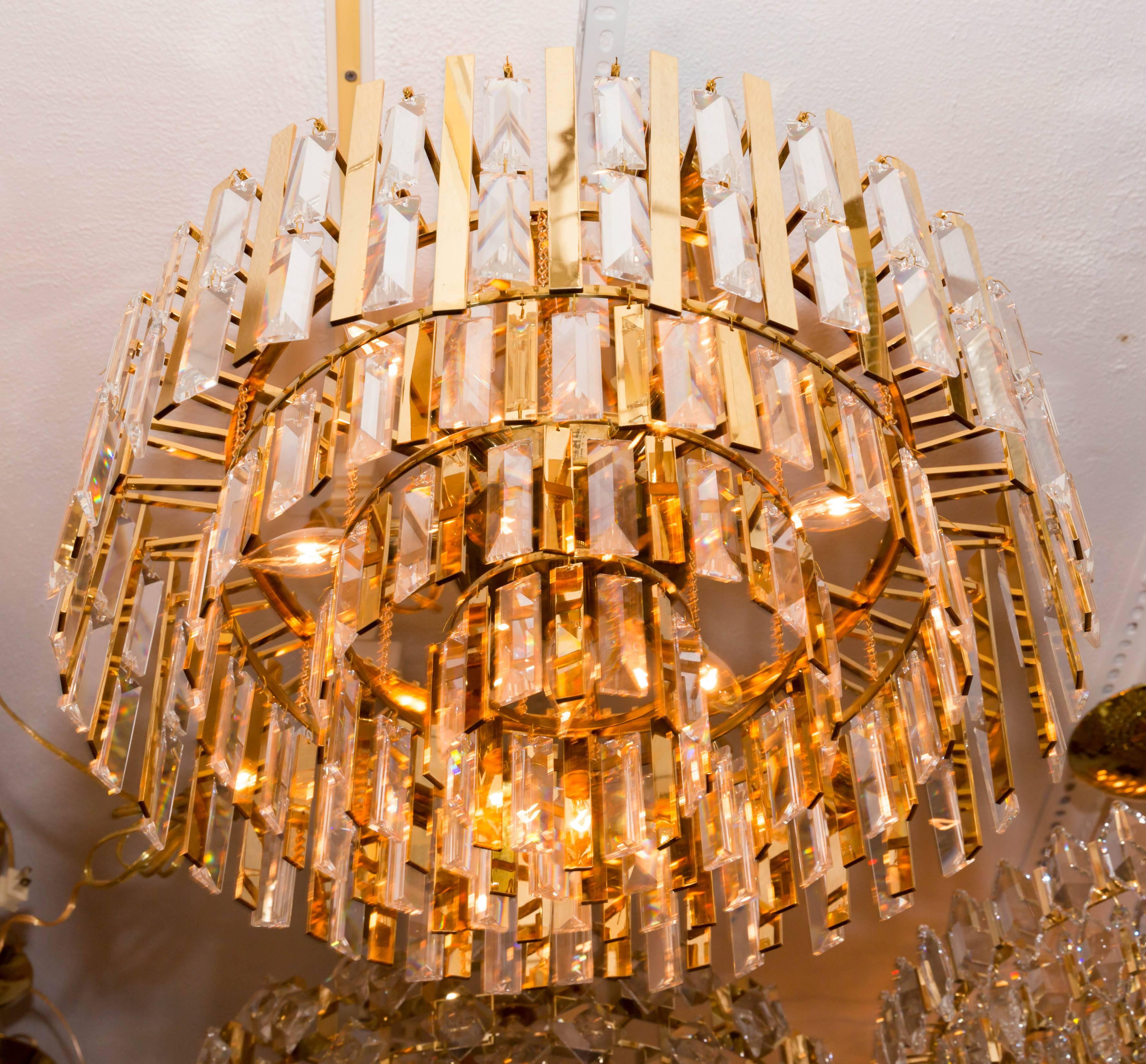 Brass Chandelier Composed of Multiple Suspended Brass Strips and Crystal Prisms In Good Condition For Sale In Bridgehampton, NY
