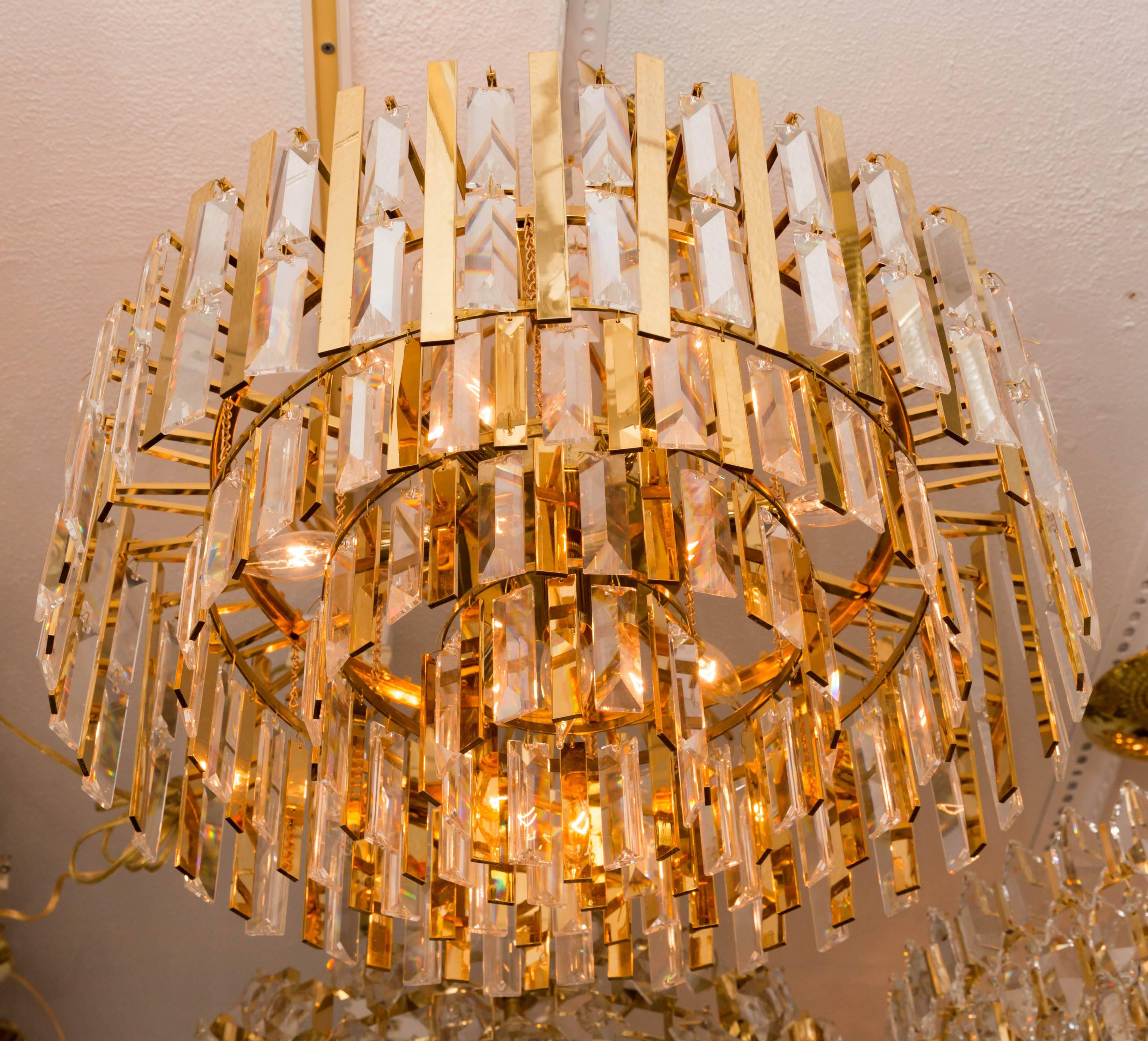 20th Century Brass Chandelier Composed of Multiple Suspended Brass Strips and Crystal Prisms For Sale