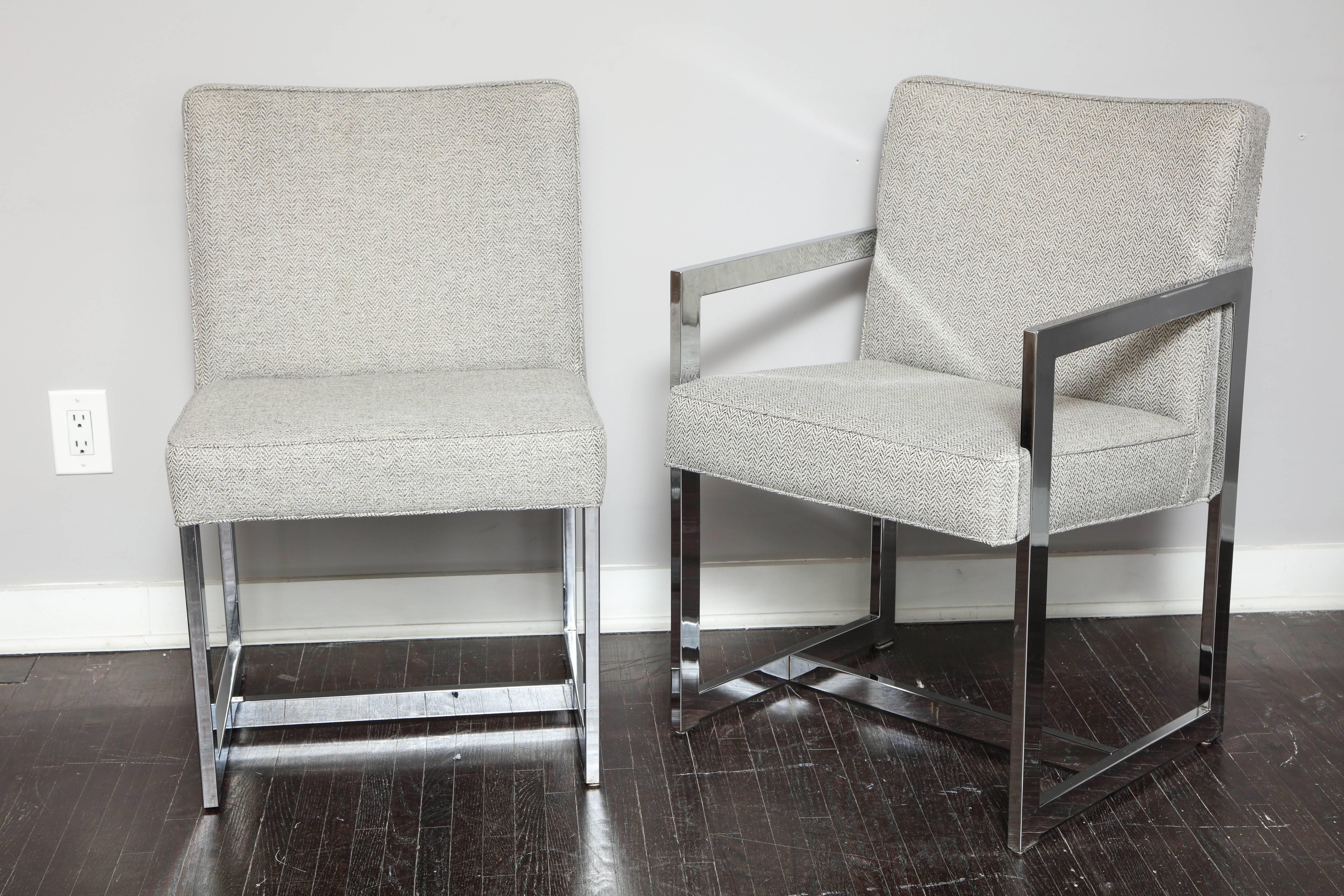 Set of four Milo Baughman dining chairs with chrome frames and new herringbone upholstery. Note two with arms and two without.