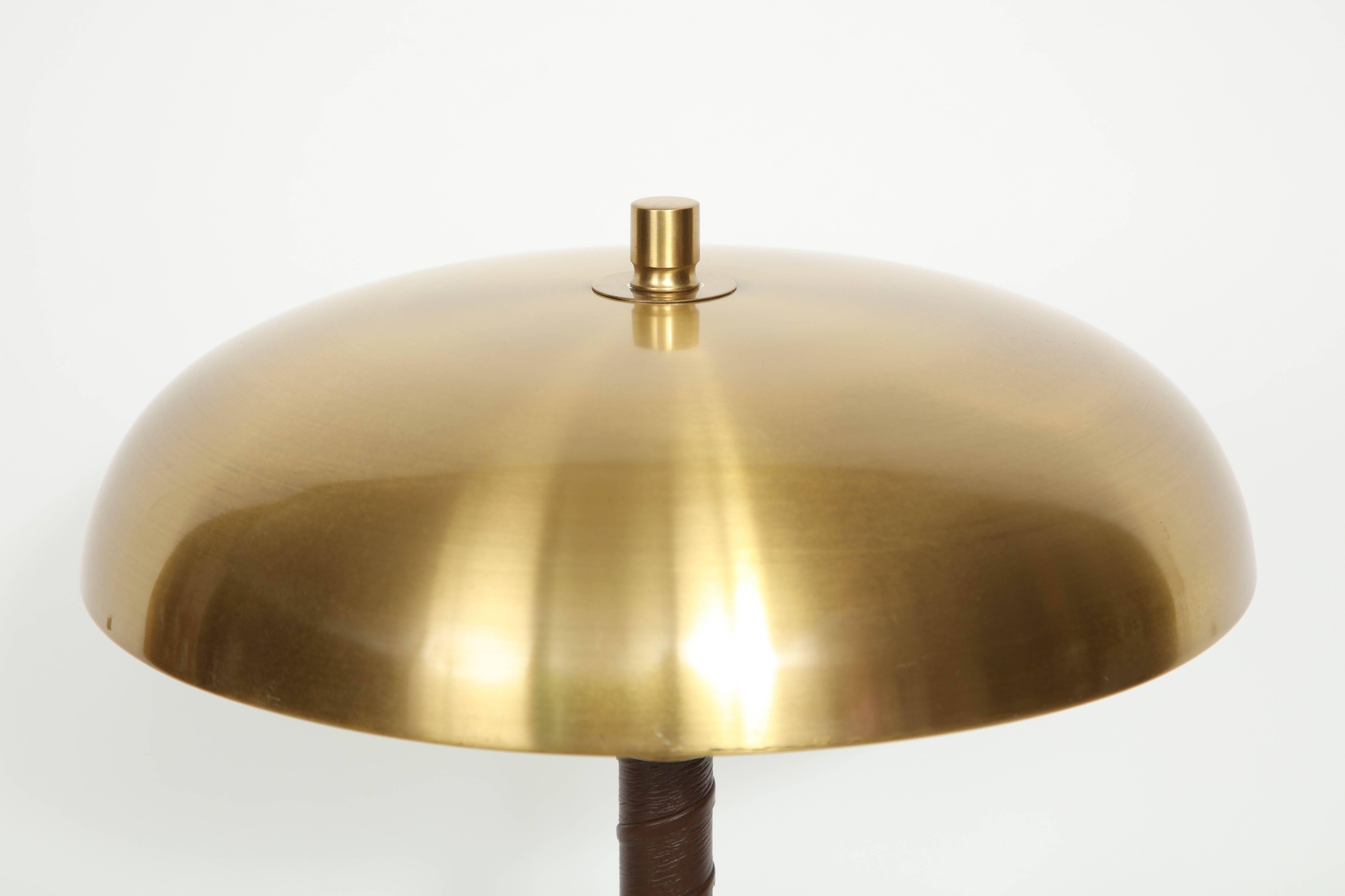Swedish table lamp by Einar Båckström, Malmö, circa 1940s dome brass top with a dark leather wrapped stem. Restored and rewired for US (2 x 60w max).