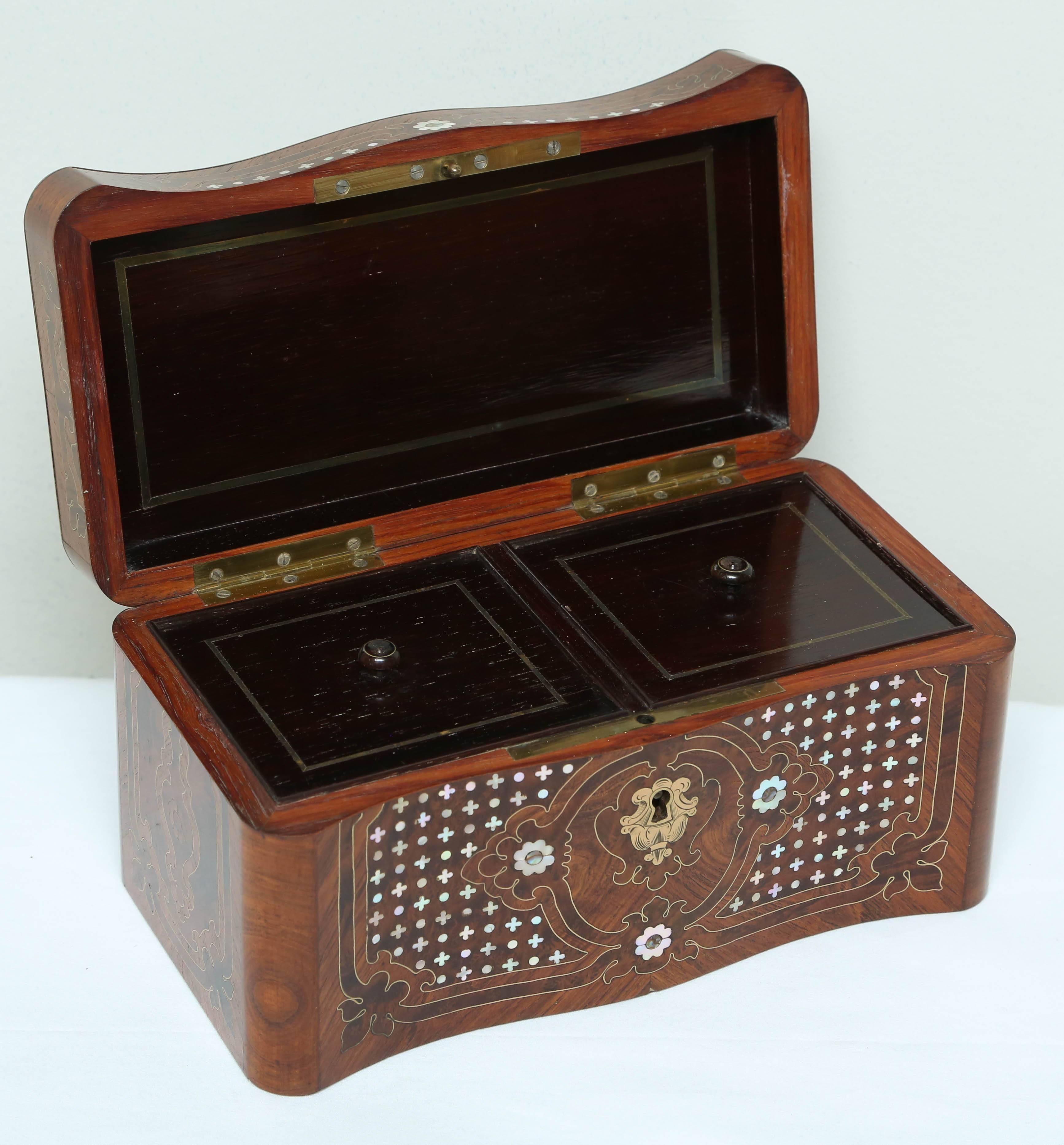 Fashioned with a mother-of-pearl inlaid dome form lid. Superior detail with inlaid brass embellishments.