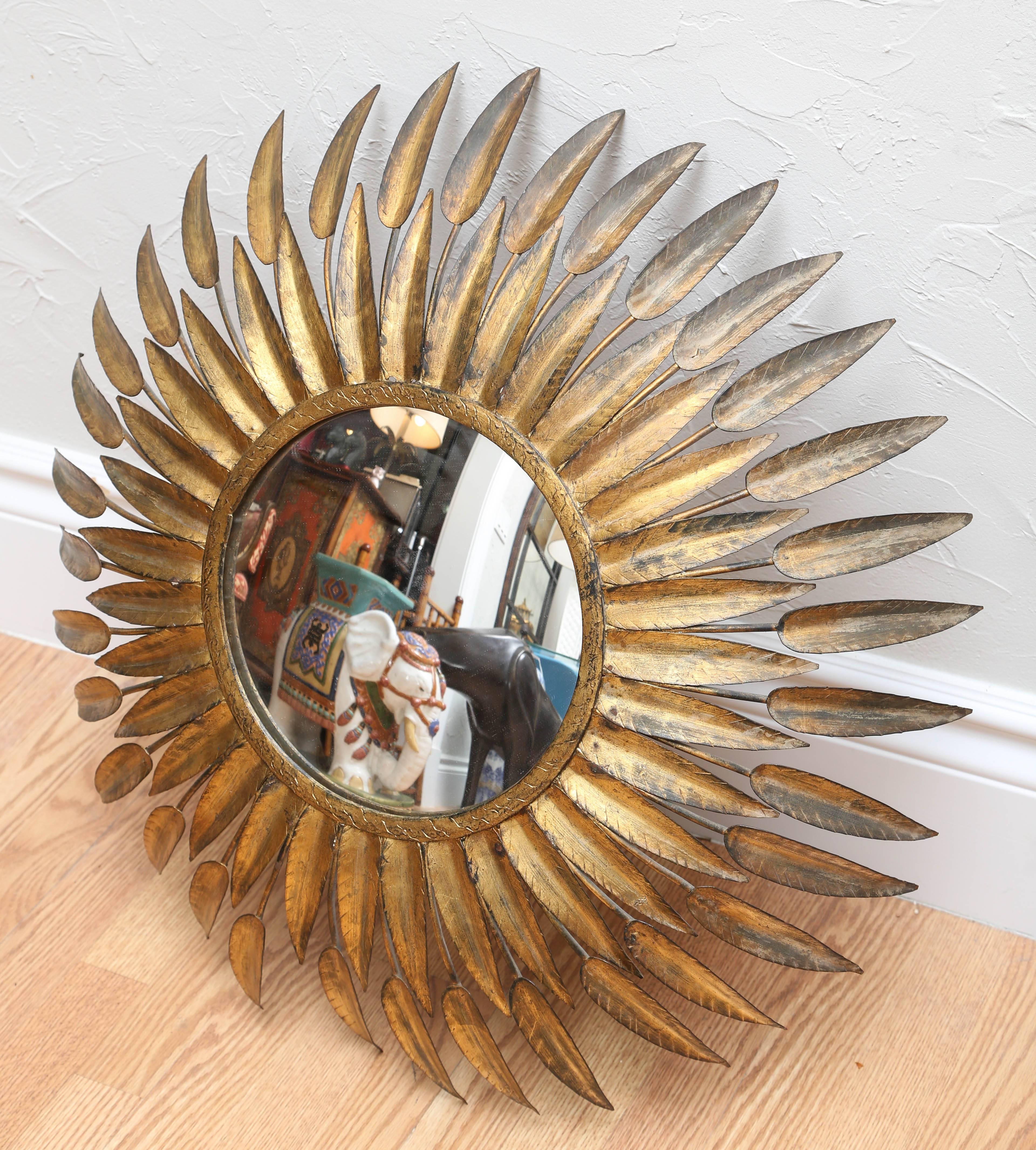 Stunning gilded metal sunburst mirror attributed to Fontana Arte.