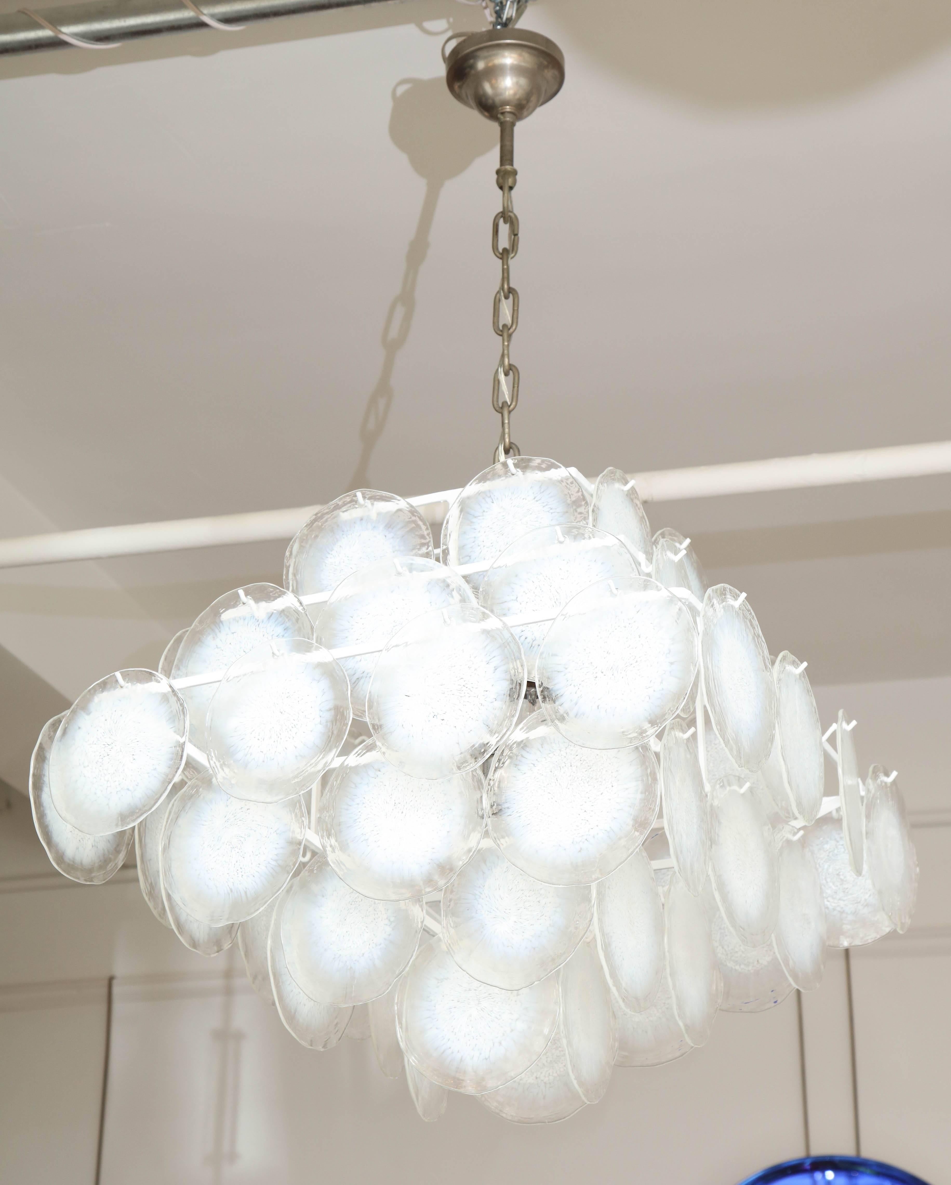 AVMazzega large modernist chandelier made in Venice 1970, original of the period. White slightly opalescence’s in the blown glass disks, great quality that will work in any setting. Takes five incandescent bulbs.
 