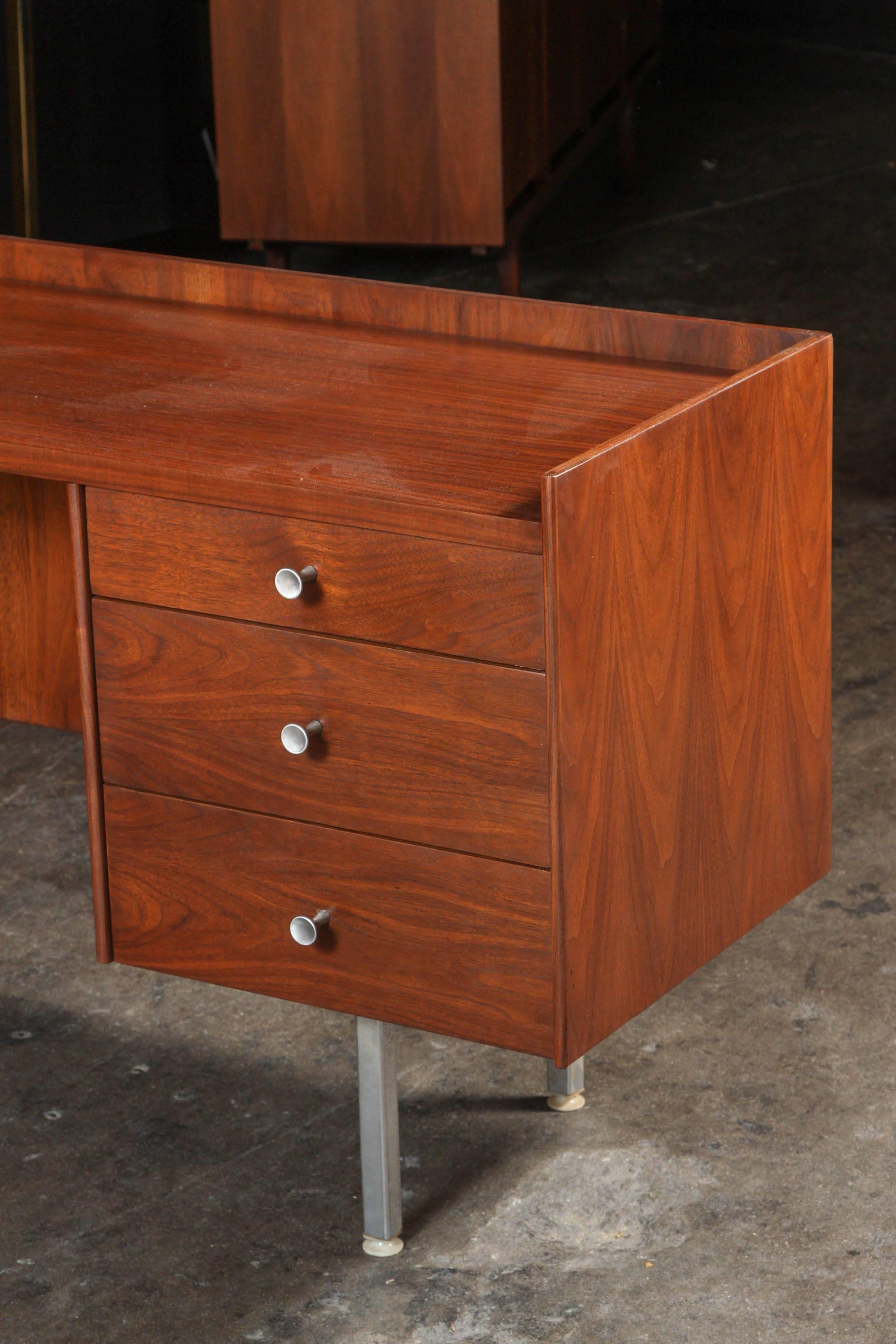 Extremely rare Milo Baughman for Glenn of California refinished walnut executive desk. Newly refinished. Walnut wood, side return, original stainless sculpted knobs, finished on both sides so you can float it in a room, this was a custom order piece