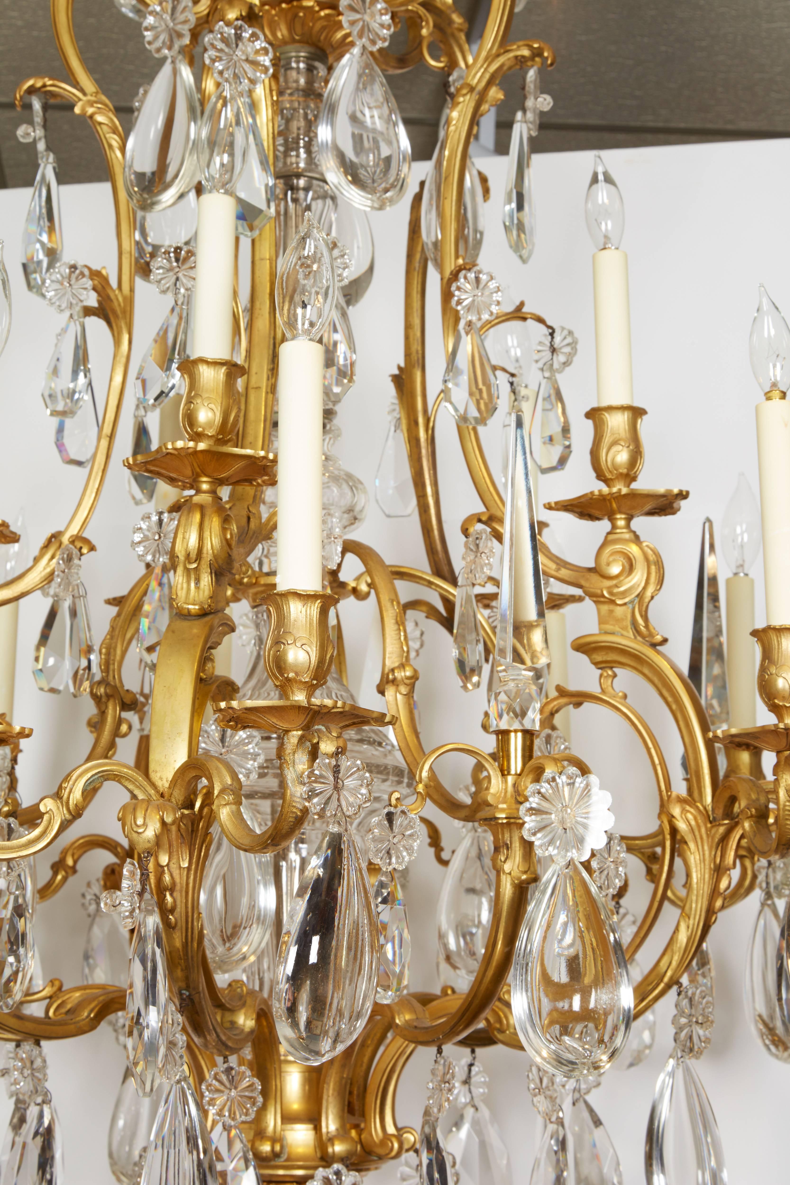 Exceptional French ormolu and Baccarat glass and rock crystal fifteen-light chandelier

Late 19th century. Very high quality French ormolu. 

Candle bobeches in the Art Nouveau taste. 

Its very possible that this chandelier was made by a