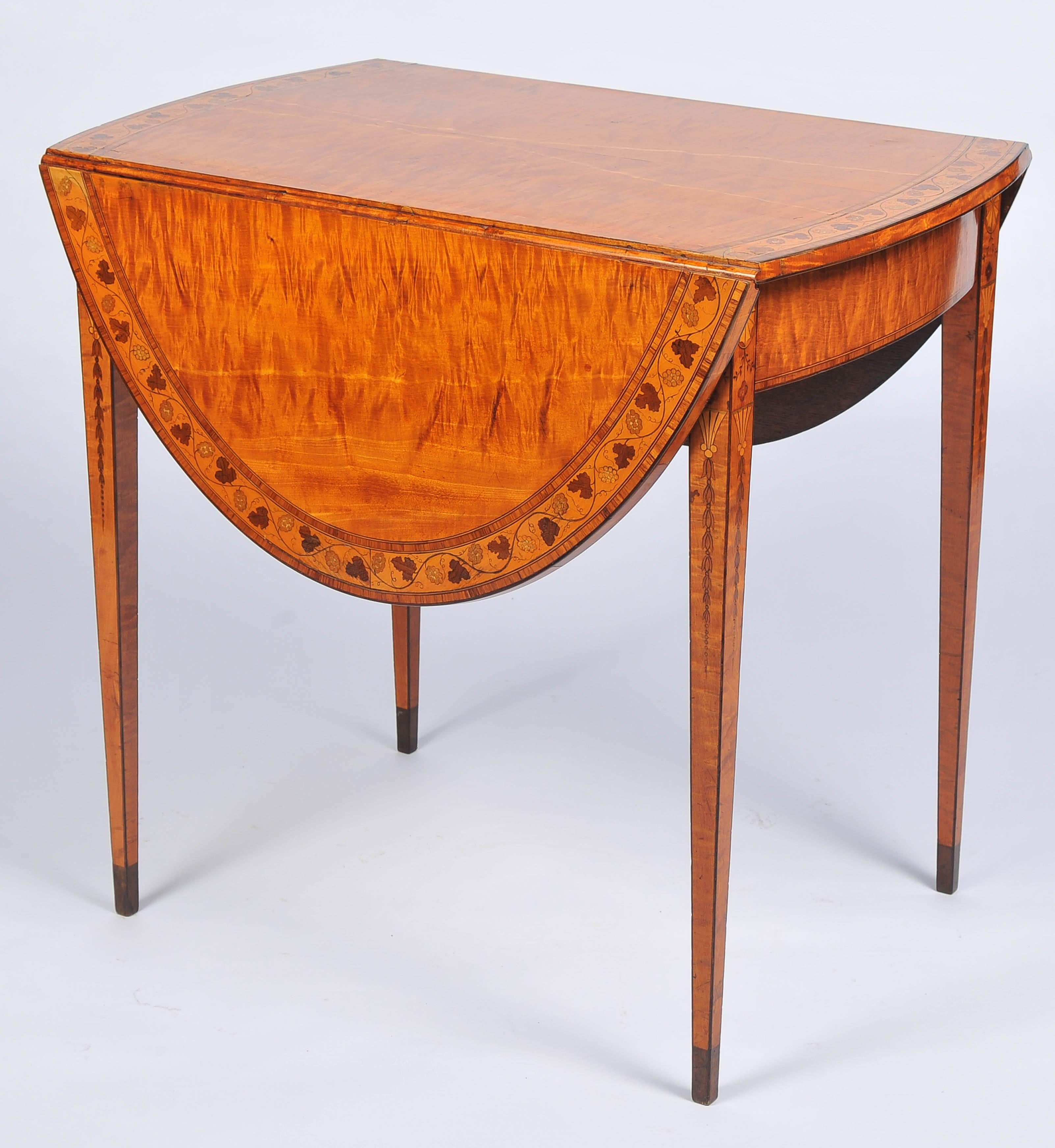 A wonderful quality 18th century Sheraton period satinwood pembroke table, having marquetry inlaid cross-banding with vine leaves and grapes, a single bow fronted frieze drawer, raised on square tapering legs with inlaid shells and leaves that