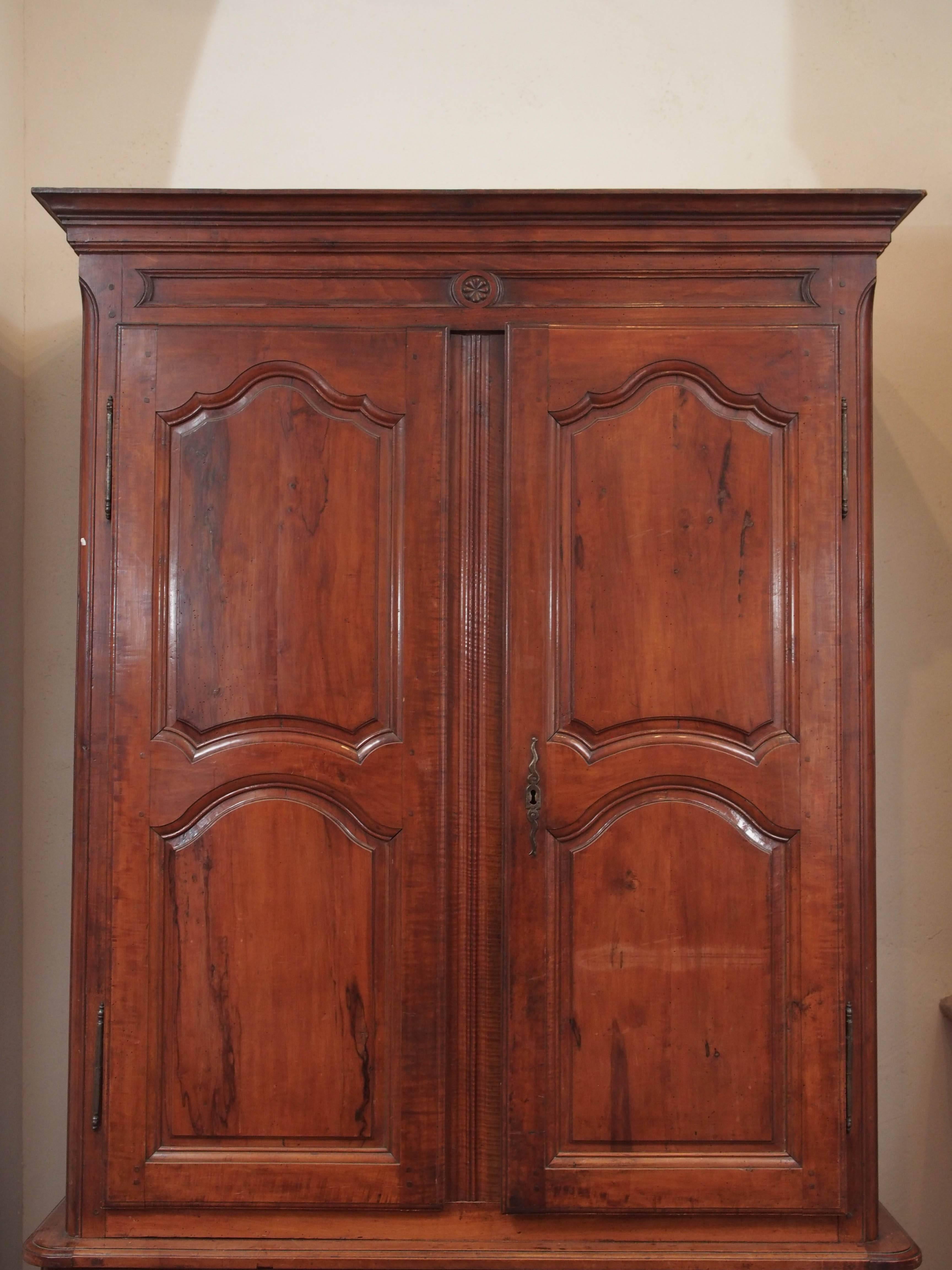 Late 18th century hand-carved walnut buffet a deux corps with four doors, two drawers from the Rhone Valley, circa 1780.