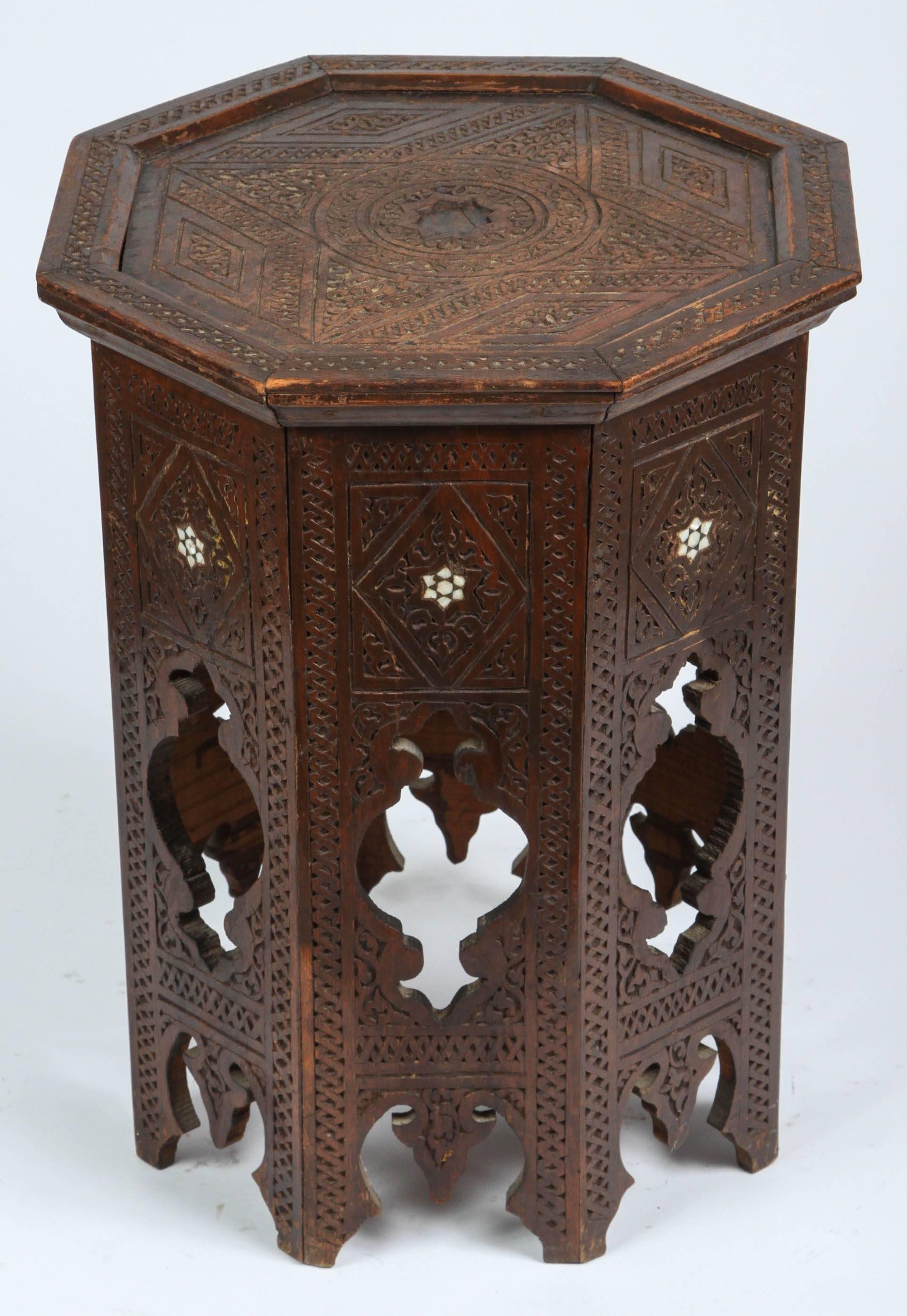 Antique 19th century Syrian octagonal side tea table, hand-carved and inlaid with mother-of-pearl.
Hand-carved with intricate Moorish designs.
Great hand cut on all sides.
Missing some inlay on top.