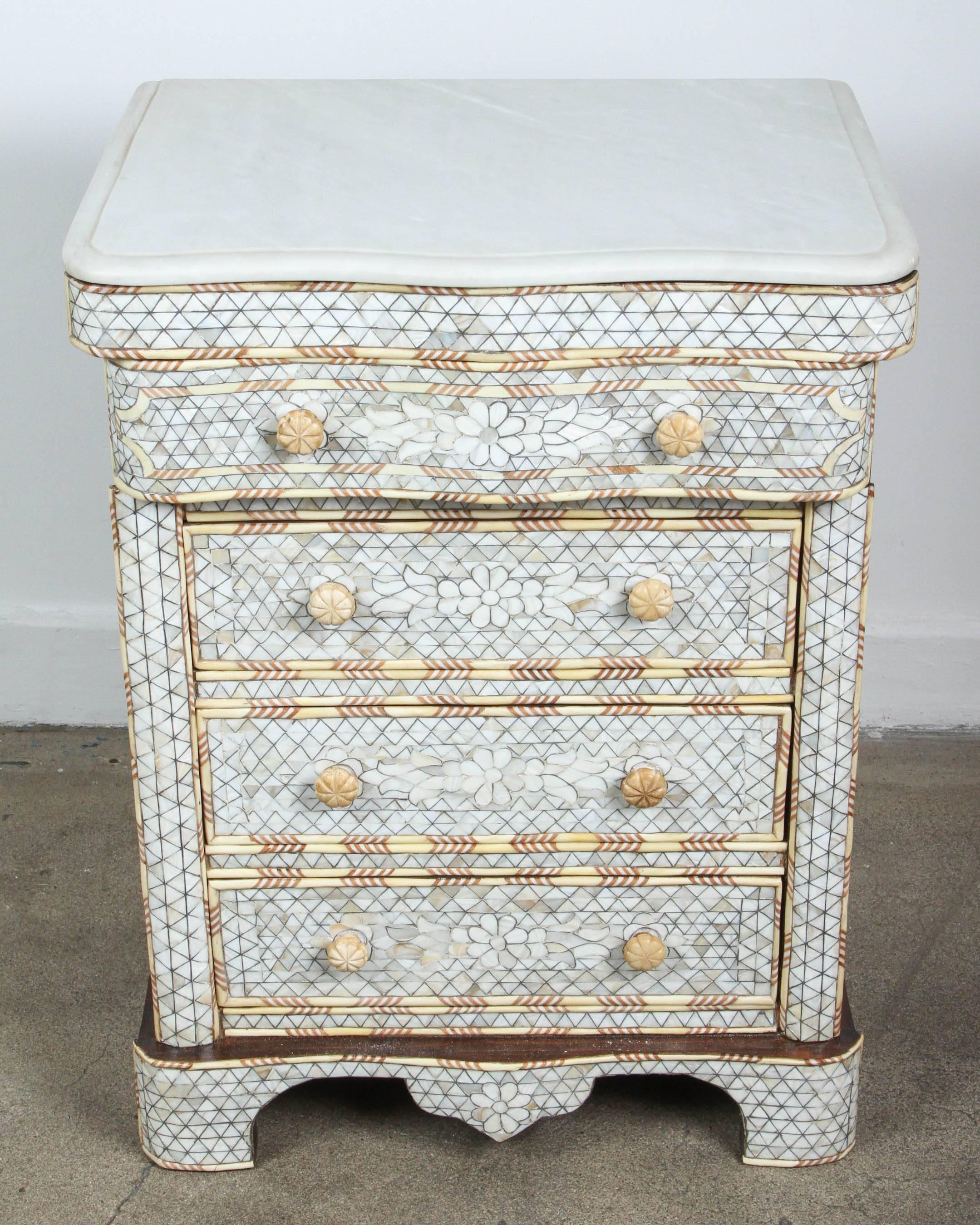 Fabulous pair of Middle Eastern Syrian mother-of-pearl inlay nightstands.
Handcrafted white small wedding dresser with four drawers, wood inlay with mother-of-pearl, shell and bone.
Moorish arches and intricate Islamic designs.
Dowry chest of
