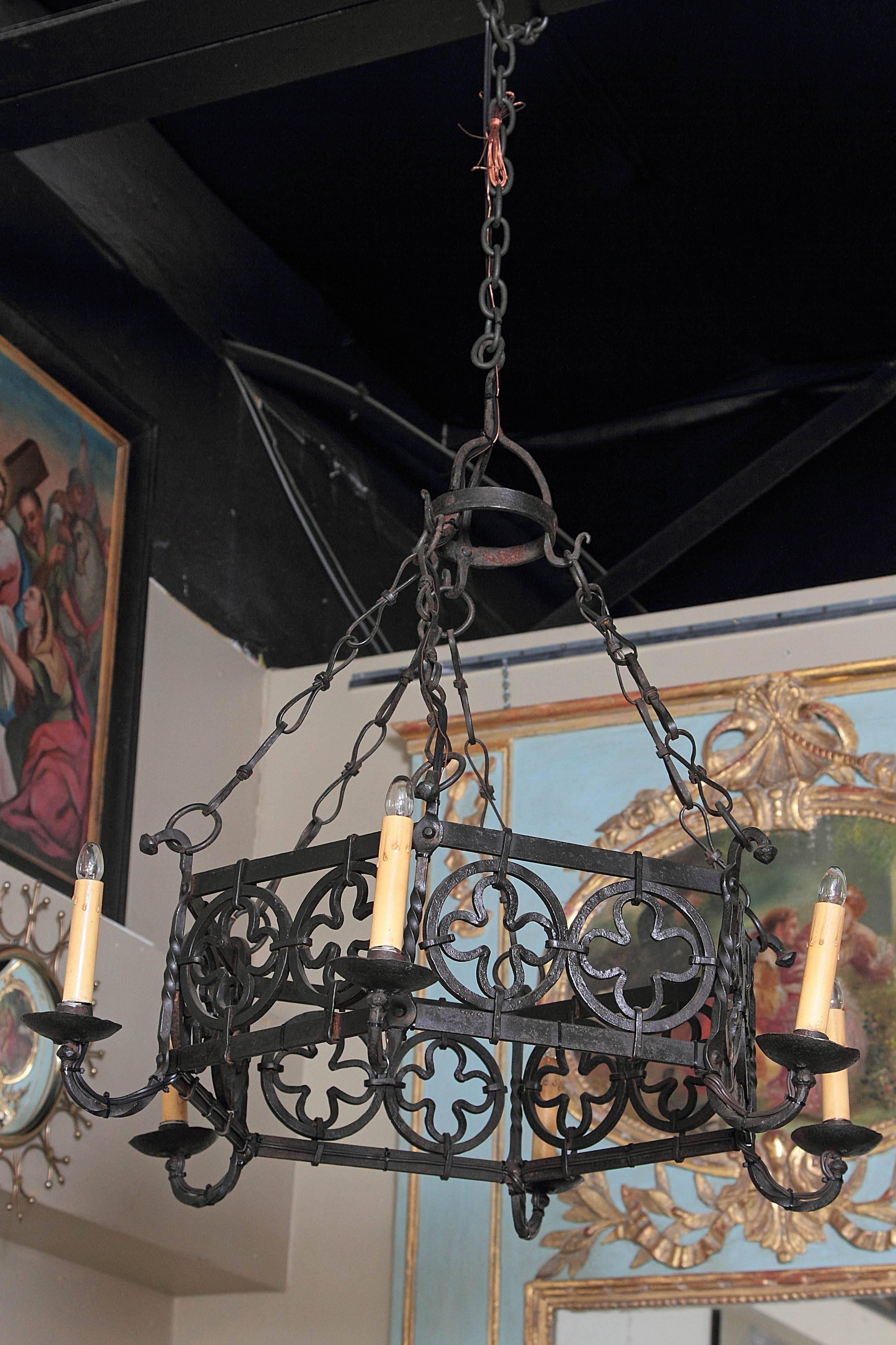 Add a rustic style to your home with this heavy, hand-forged chandelier from Southern France, circa 1870. Place the Gothic fixture with six sides and six lights in a living room or dining room for an antique, French countryside look. The piece has