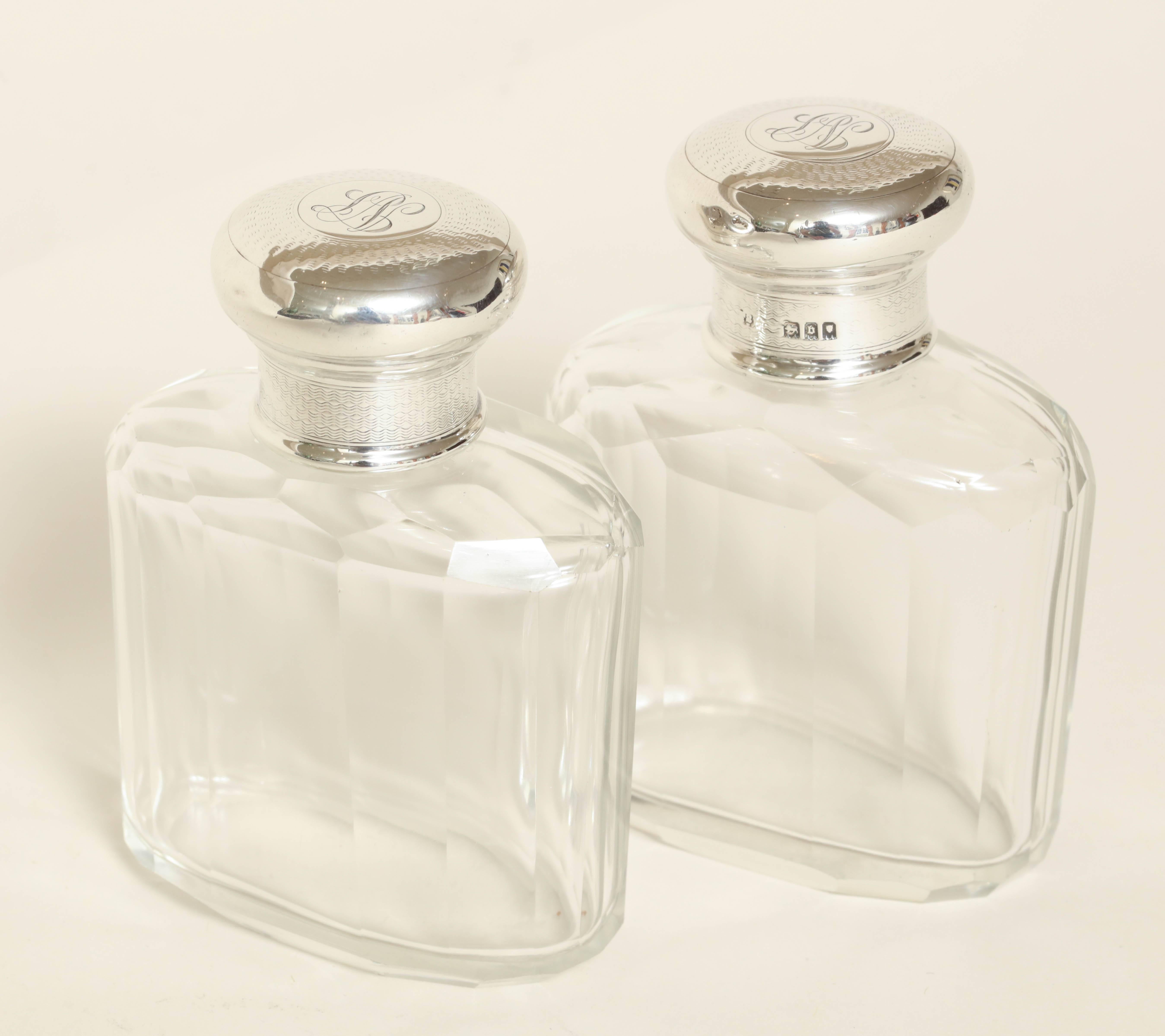 Measures: 3 ¾'' high

Faceted crystal body with silver screw tops.

Monogrammed L V.
Impressed for 925 silver/ London/ 1917/ S D.

(Price shown is reduced price, no further trade discount) 