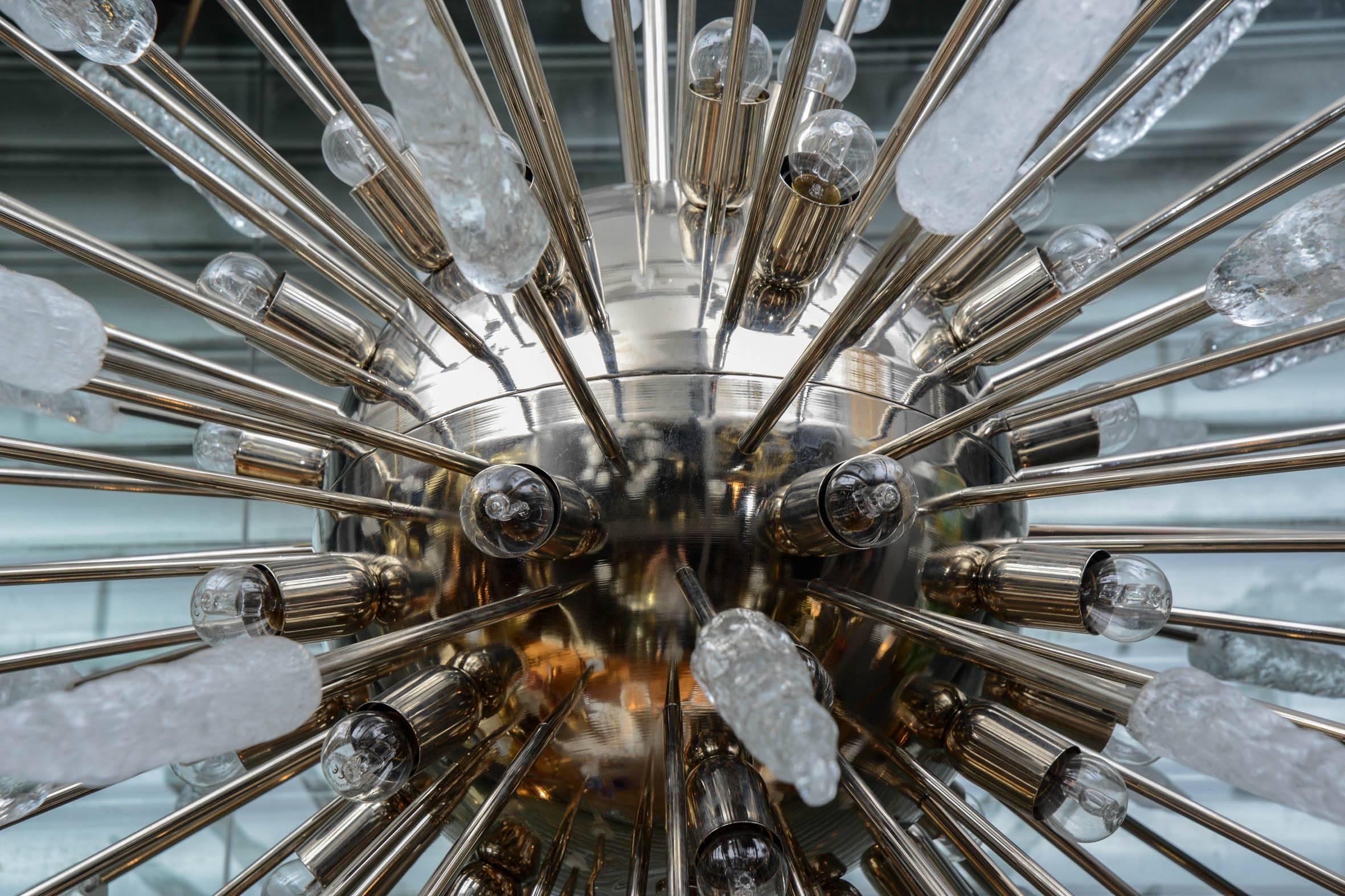 Huge Sputnik chandelier made of a brass structure and arms, ended by Murano glass spikes with two different colours.