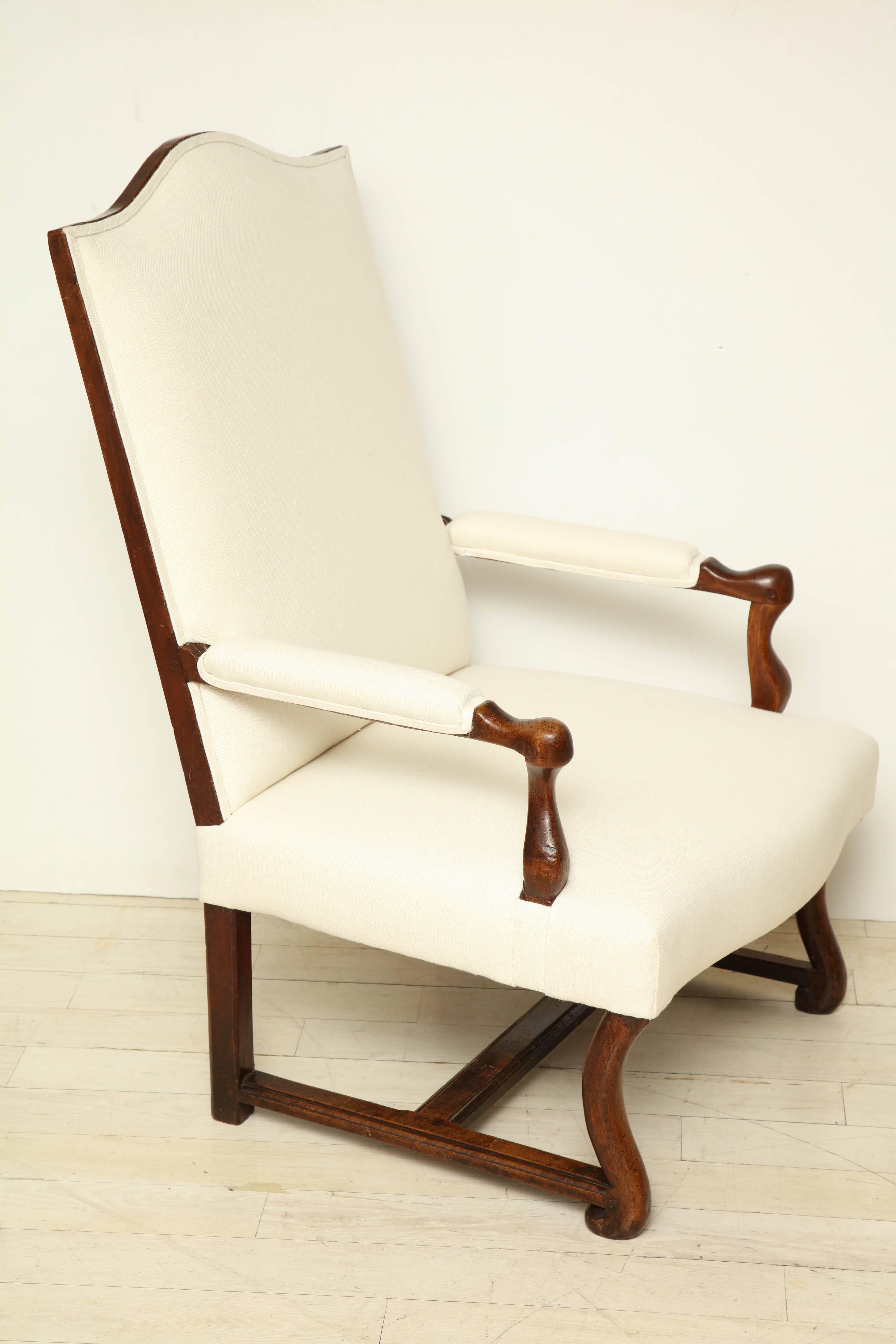 Walnut Louis XIV armchair newly upholstered in ivory linen.

      