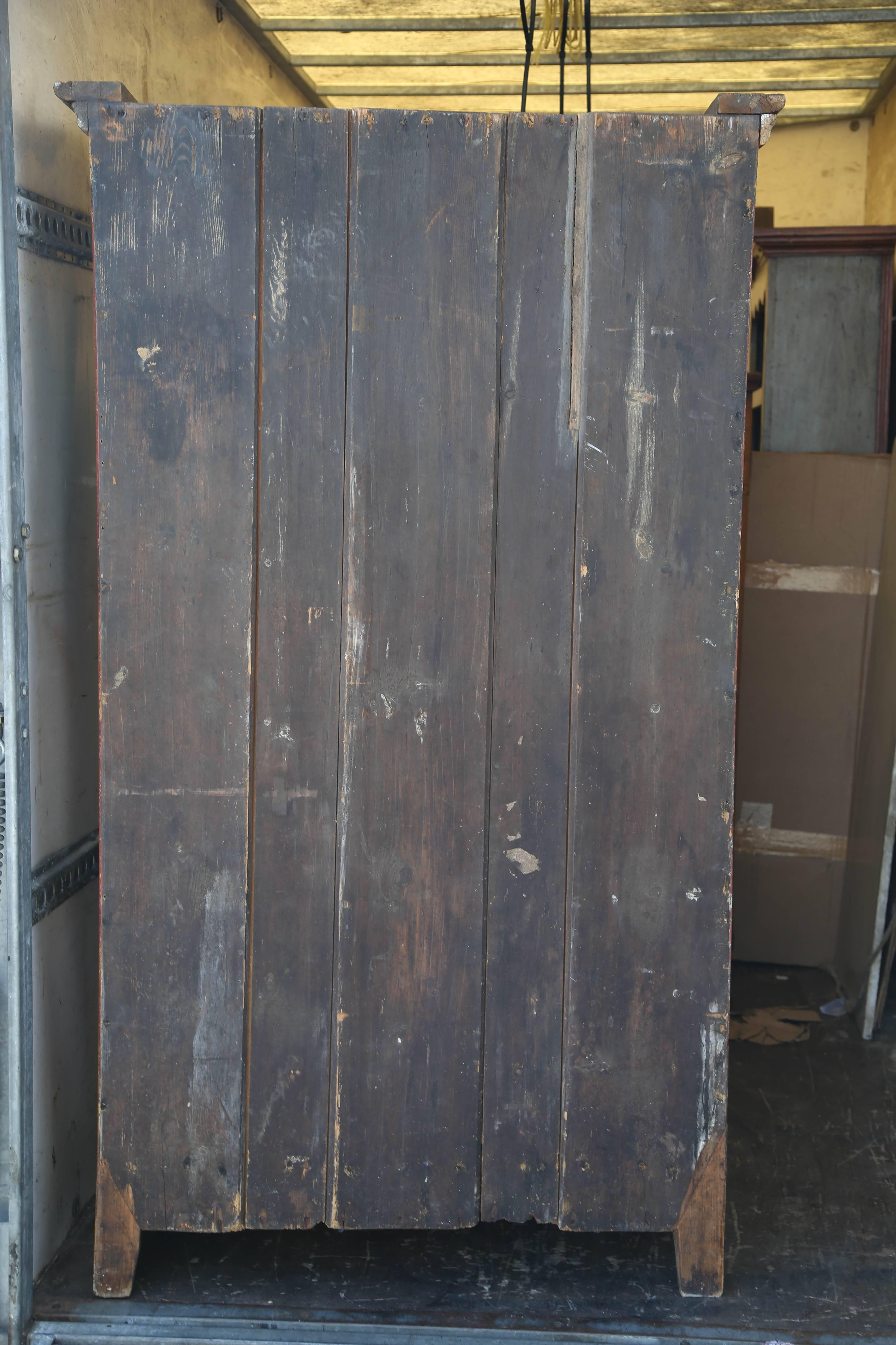 This is a very nice all original hand-painted single door armoire made in Italy in the early 1800s. Under the paintwork its solid pine, a great looking decorative piece of furniture which could be used in any room. The paintwork is in very good
