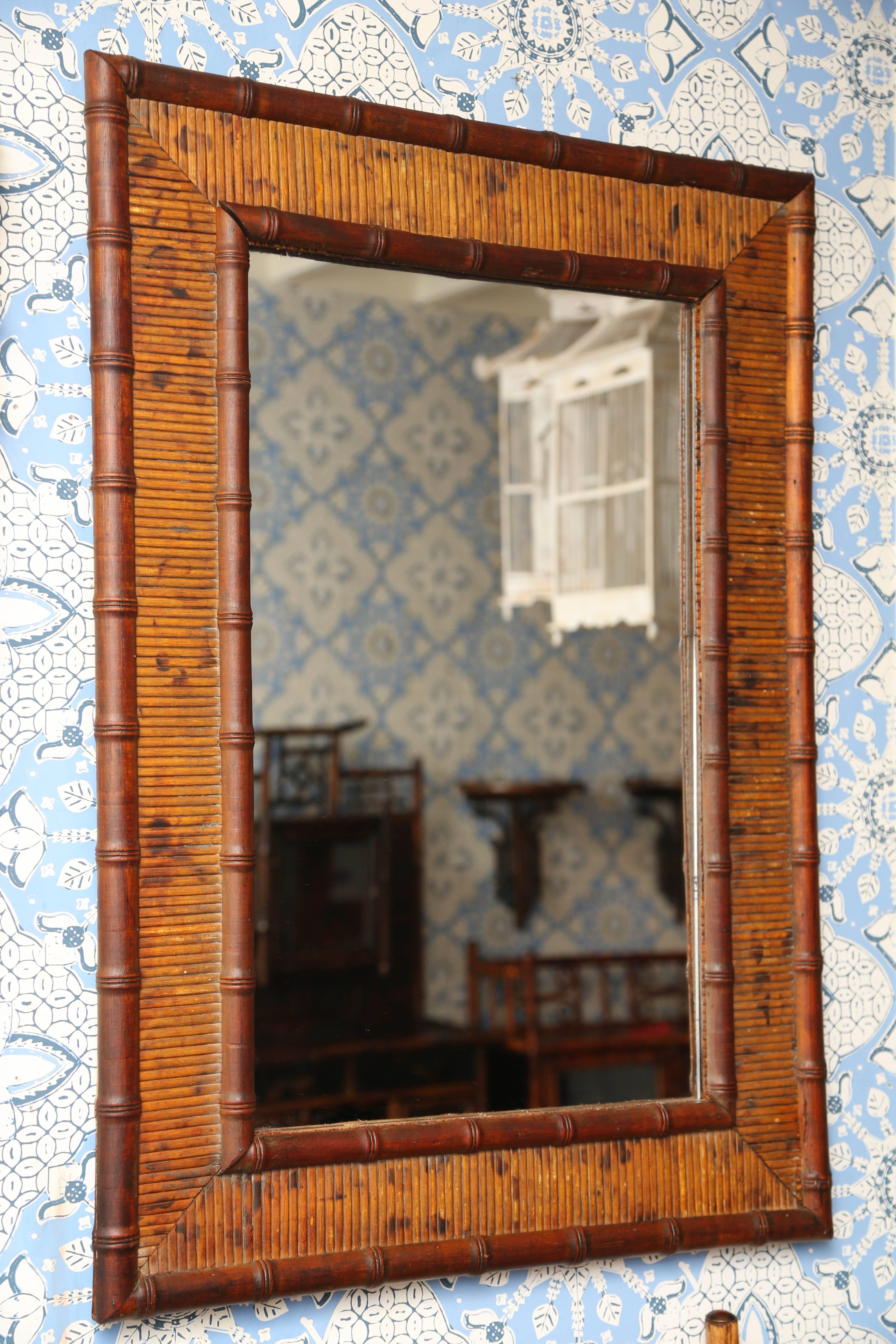 Sweet French bamboo framed mirror with plenty of details. Measures: 35 1/2