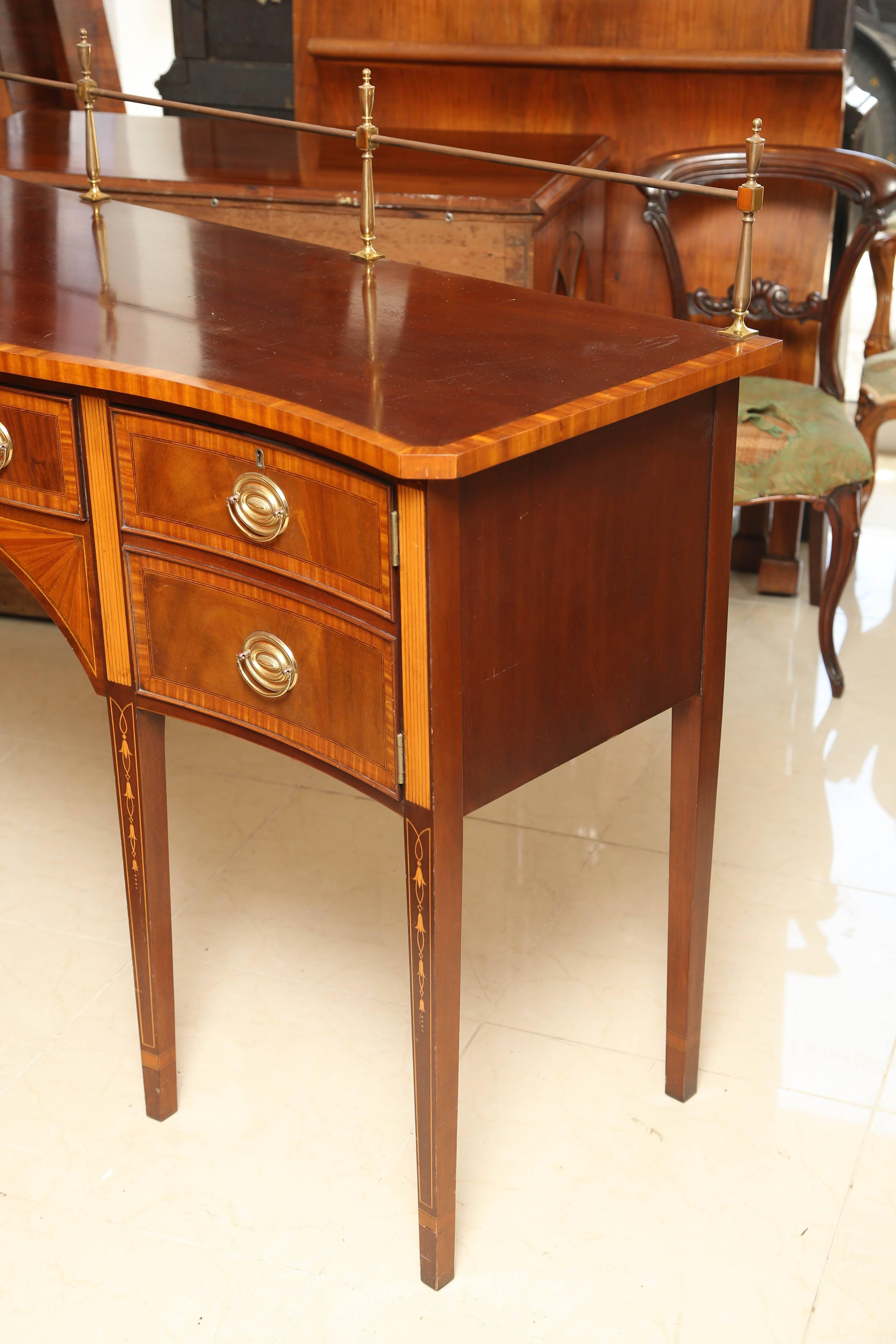 This is a very nice mahogany server made in USA by Couneill.
Its in excellent condition very nice satinwood marquetry inlay sitting on square tapered legs, with a brass gallery to the back.
Original brass handles and also has the original
