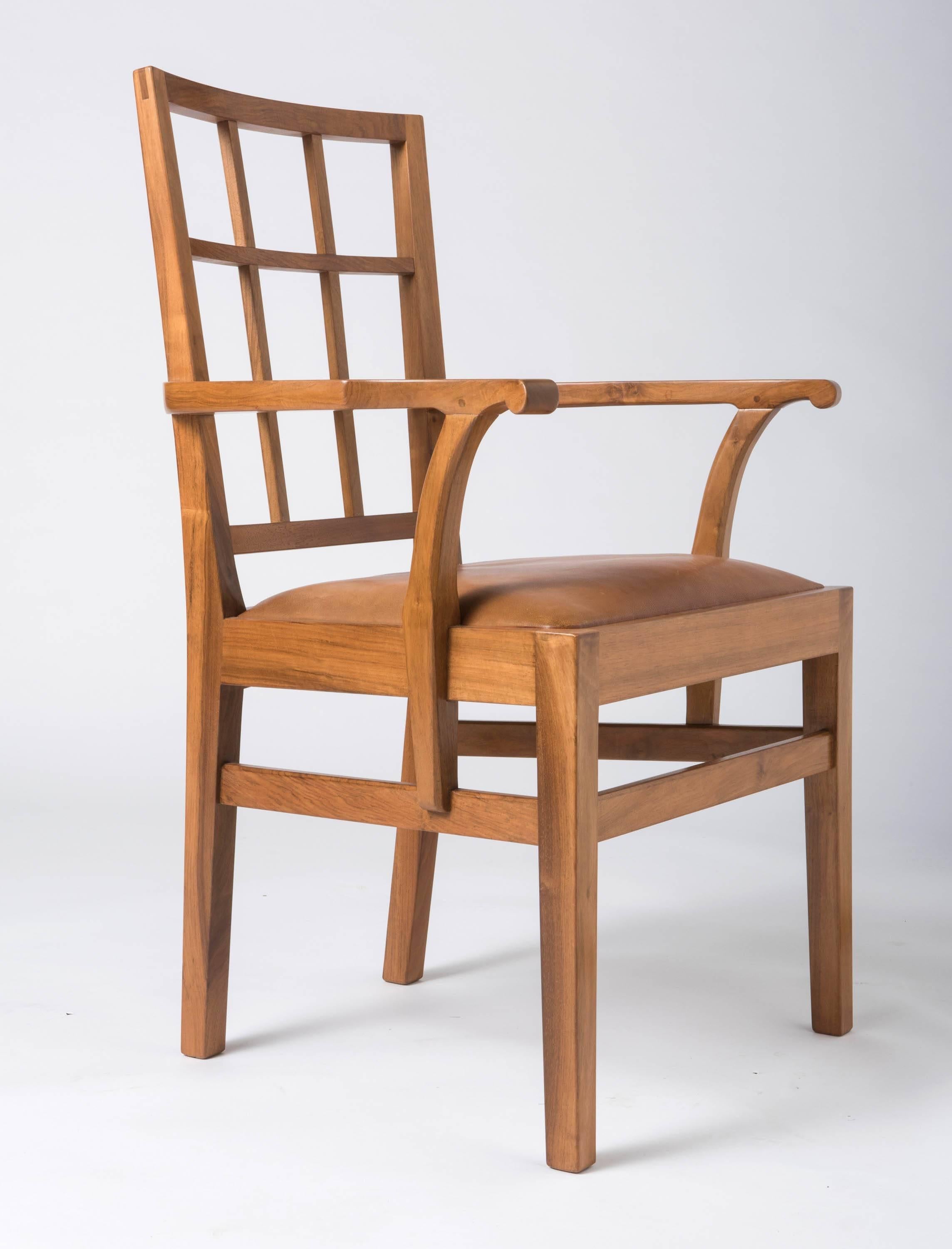 A rare set of eight walnut dining chairs by Edward Barnsley.
Lattice back
Six chairs and two carvers.
England, circa 1947.
Chairs : 88 cm high x 46 cm wide x 42 cm deep and seat height 48 cm.
Carvers : 92 cm high x 59 cm wide x 46 cm deep and seat