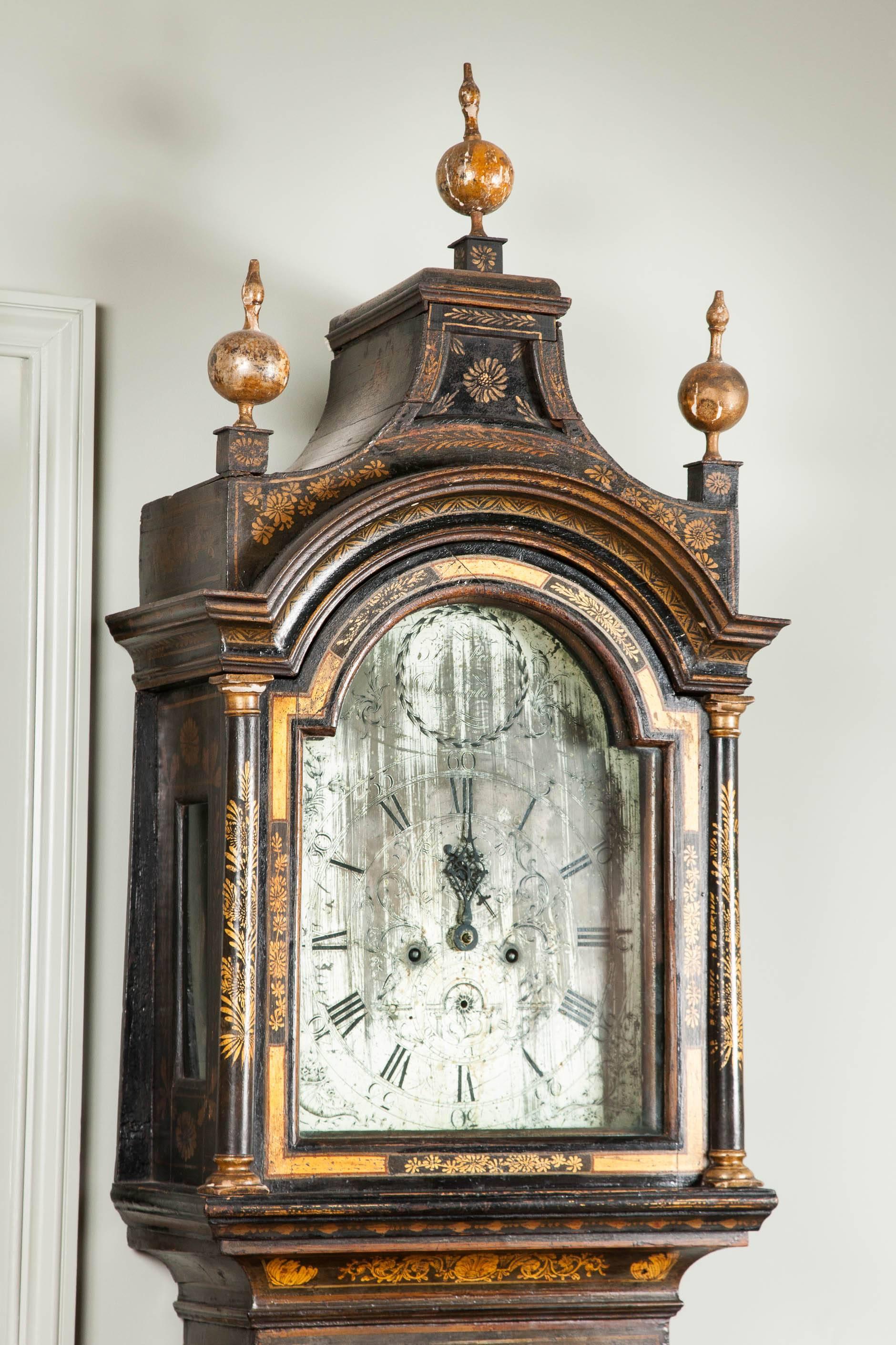 John Peat, Darlington: an 18th century green lacquer and Chinoiserie decorated longcase clock with pagoda hood above an arched silvered dial supporting twin train striking movement.