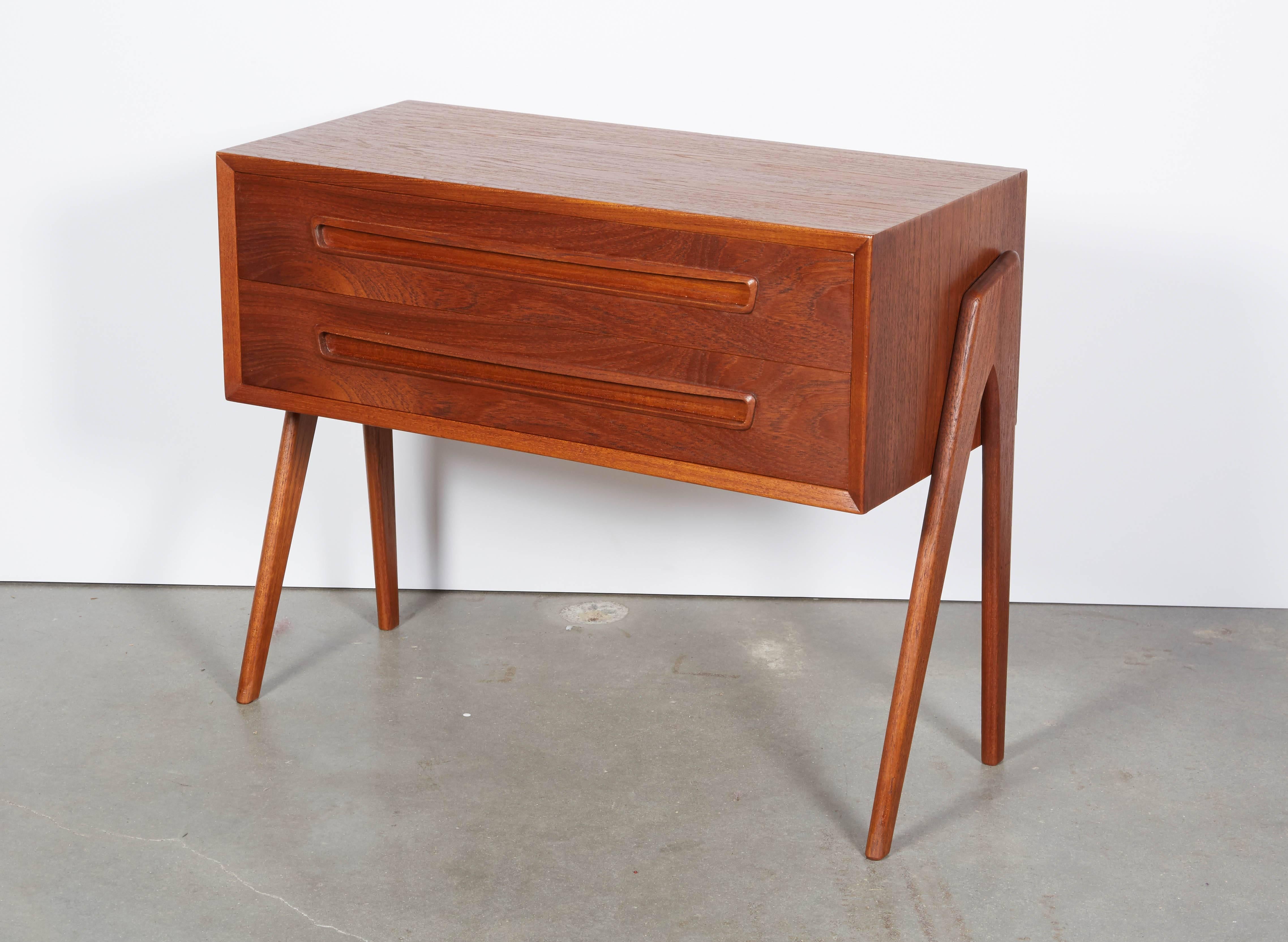 Vintage 1950s Teak Bedside Table

This mid century night stand goes harmoniously in many different decor environments. Can also be used around the house for extra storage. Ready for pick up, delivery, or shipping.