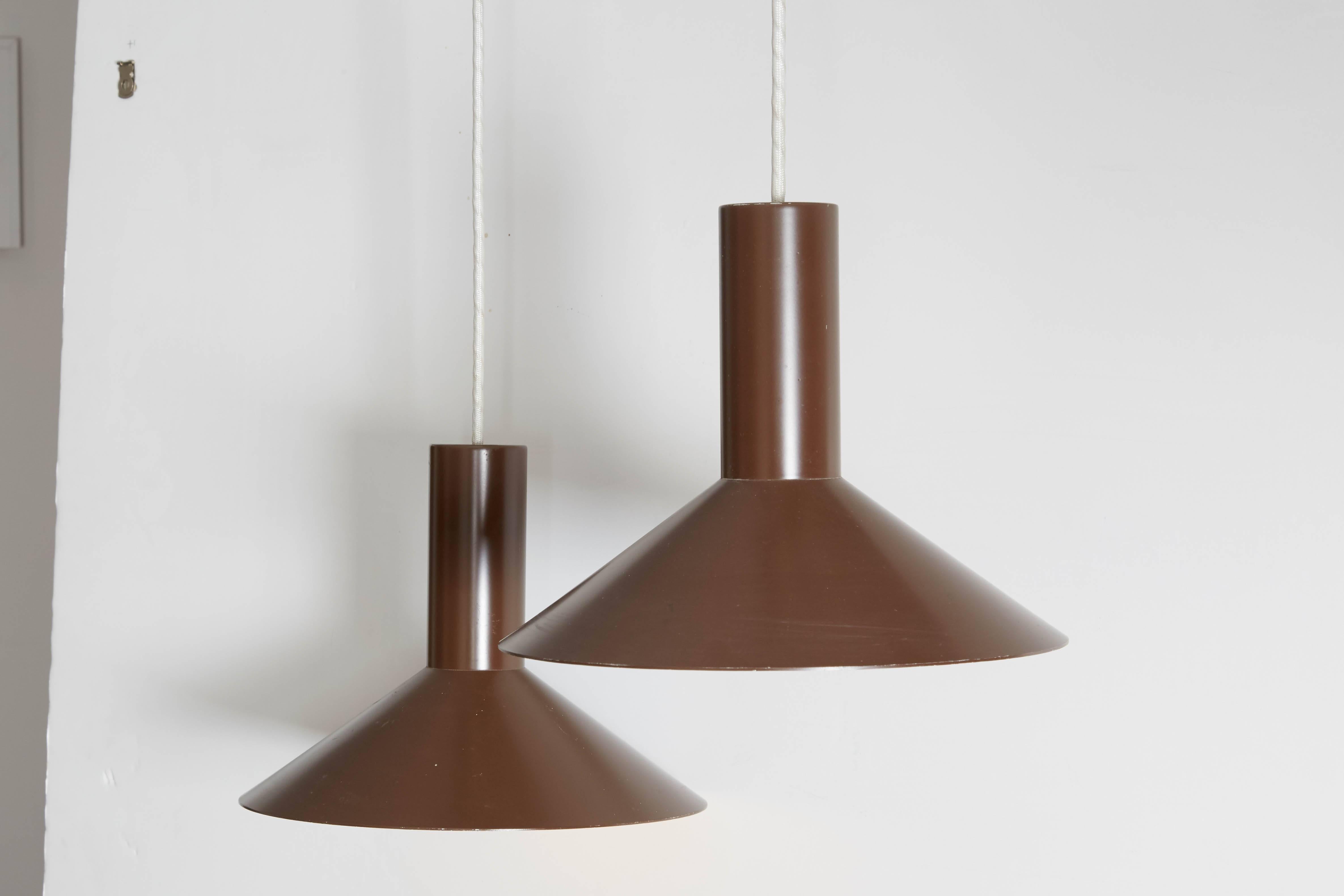 Vintage 1960s Brown Pendent Lamps, Pair

This pair of mid century pendents are in excellent condition. Great for the kitchen island, breakfast nook, dining room, or hallway. Ready for pick up, delivery, or shipping anywhere in the world.