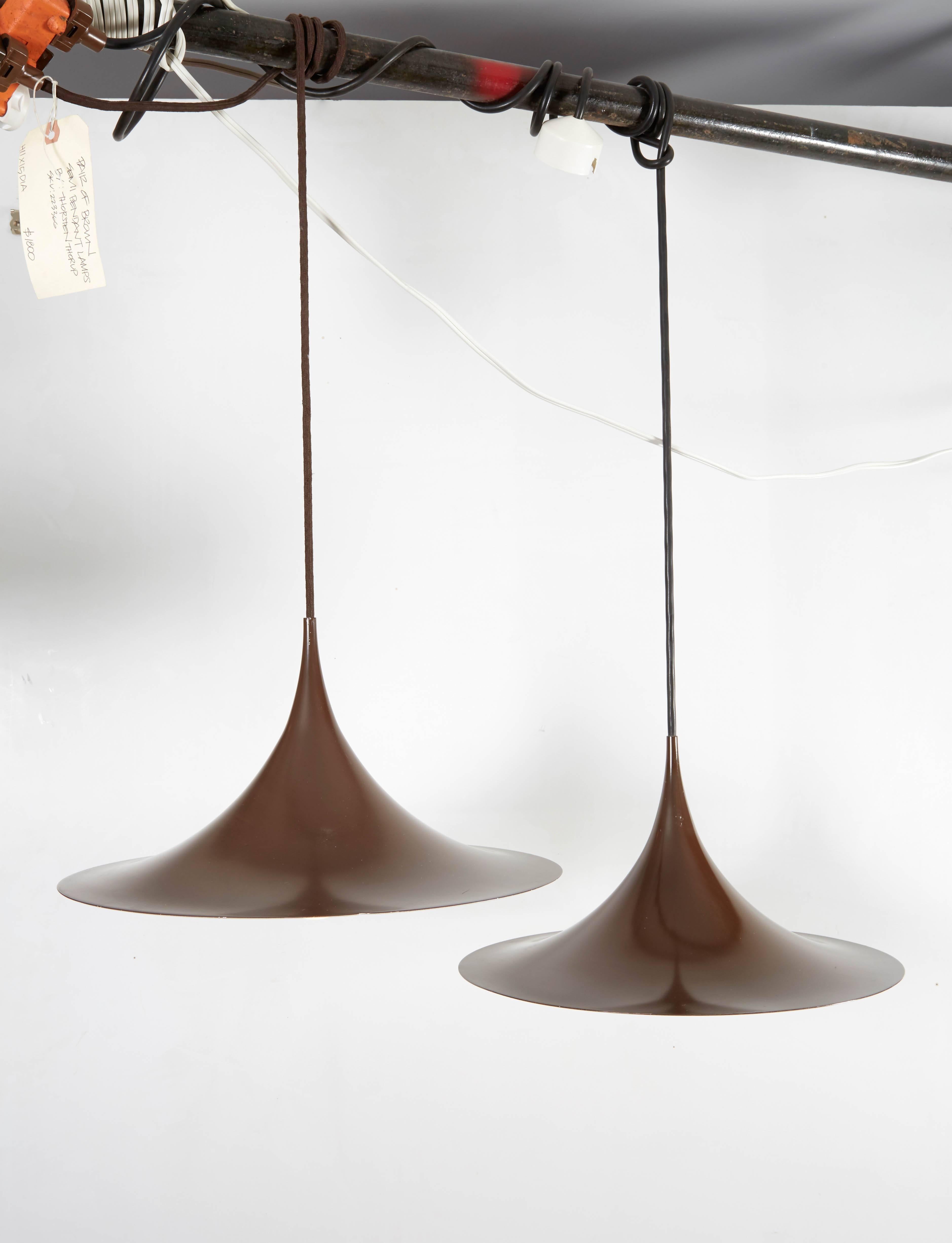 Vintage 1960s Fog & Morup Pendent Lamps 

These brown midcentury pendent lamps tare in excellent condition. The brown fits into any home is a very elegant but understated way. Excellent for a kitchen, entry, hallway, or dining room. Ready for
