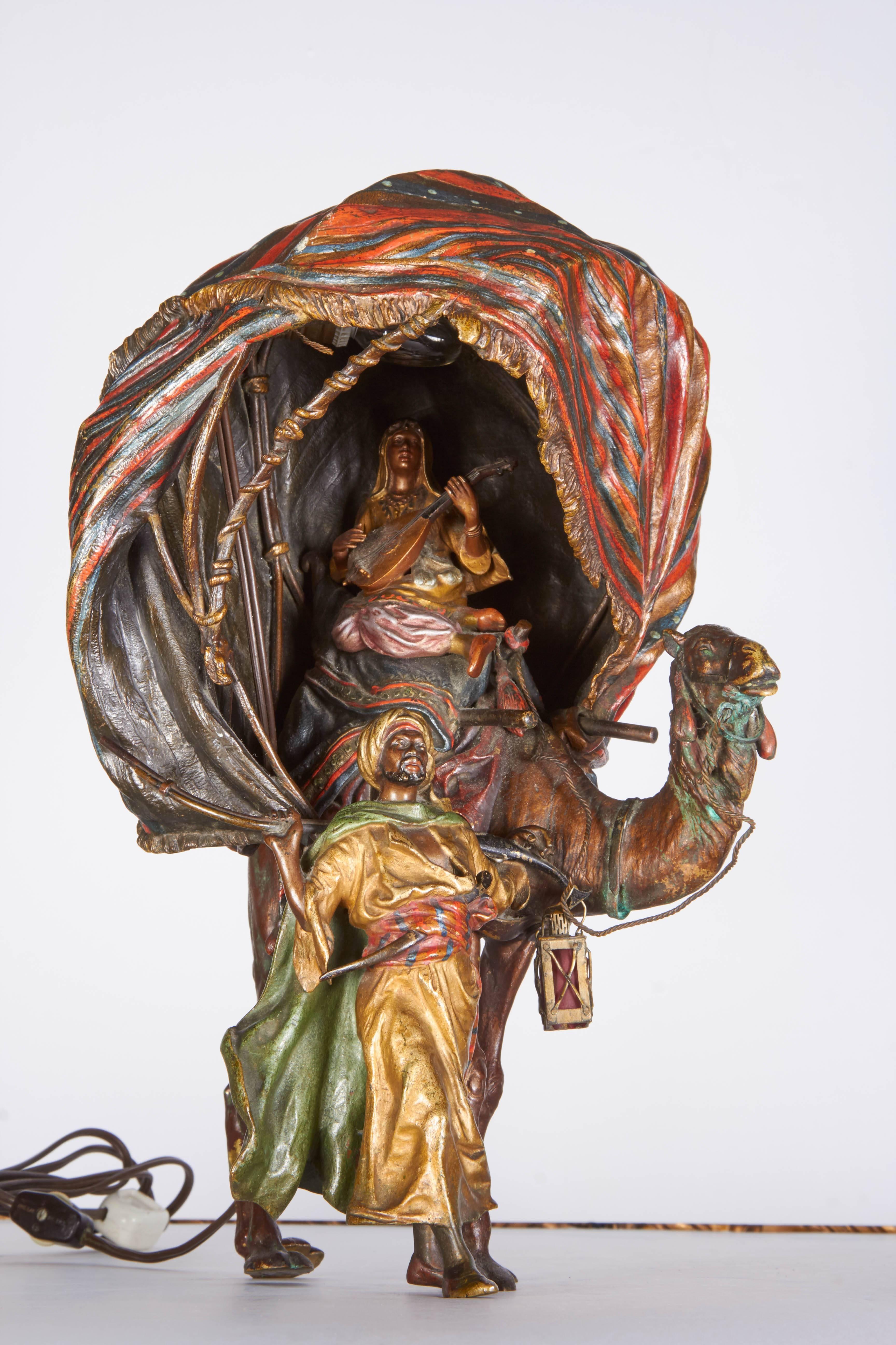 A very fine antique Austrian cold painted orientalist bronze lamp of a princess playing a musical instrument sitting on a camel being led by an orientalist soldier, by Bergman.
Measures: Height 14”
Width 9”.