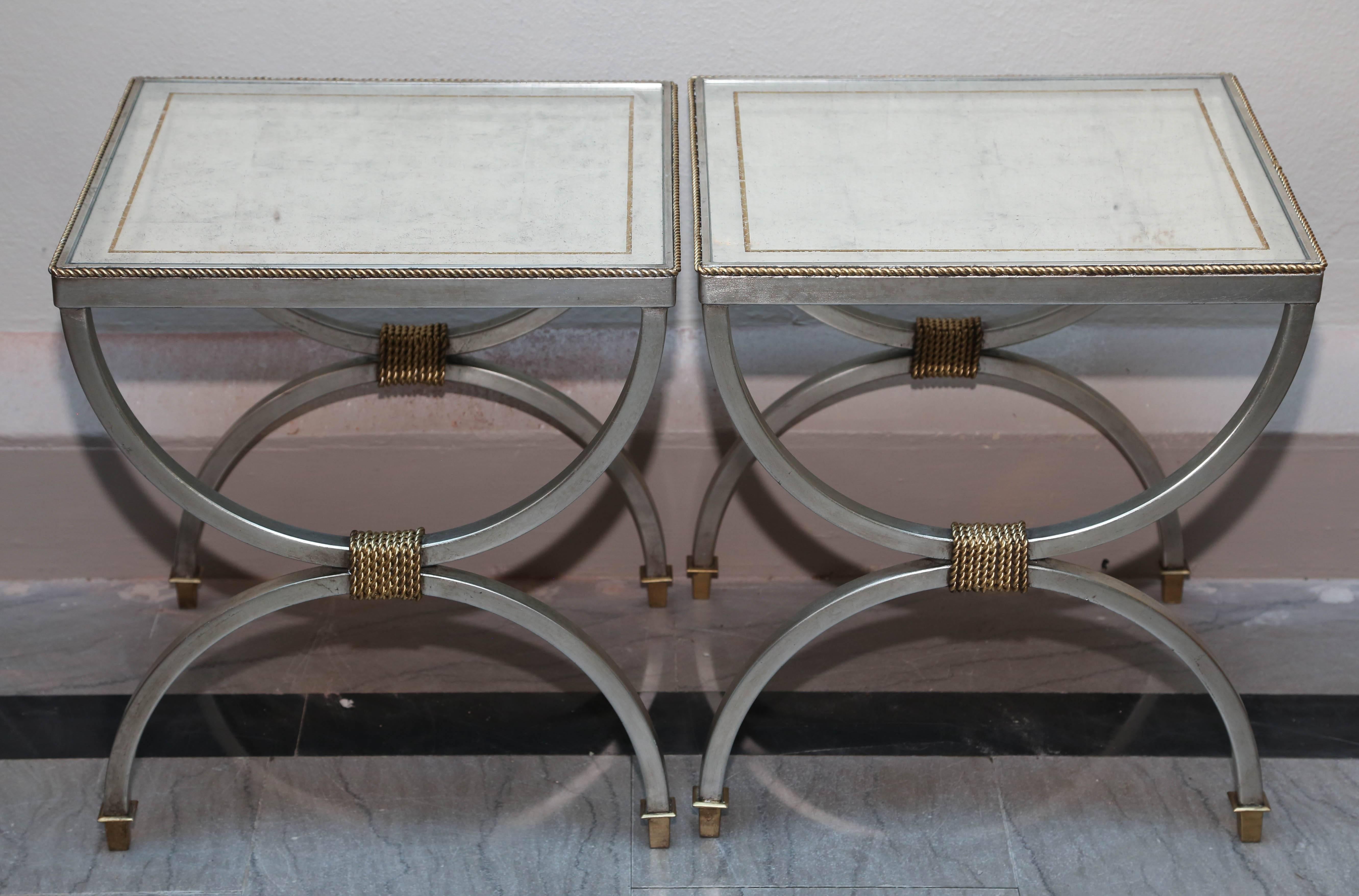 Fitted with silver leafed and "mirrored" tops, original Century designer pieces. A stunning pair.