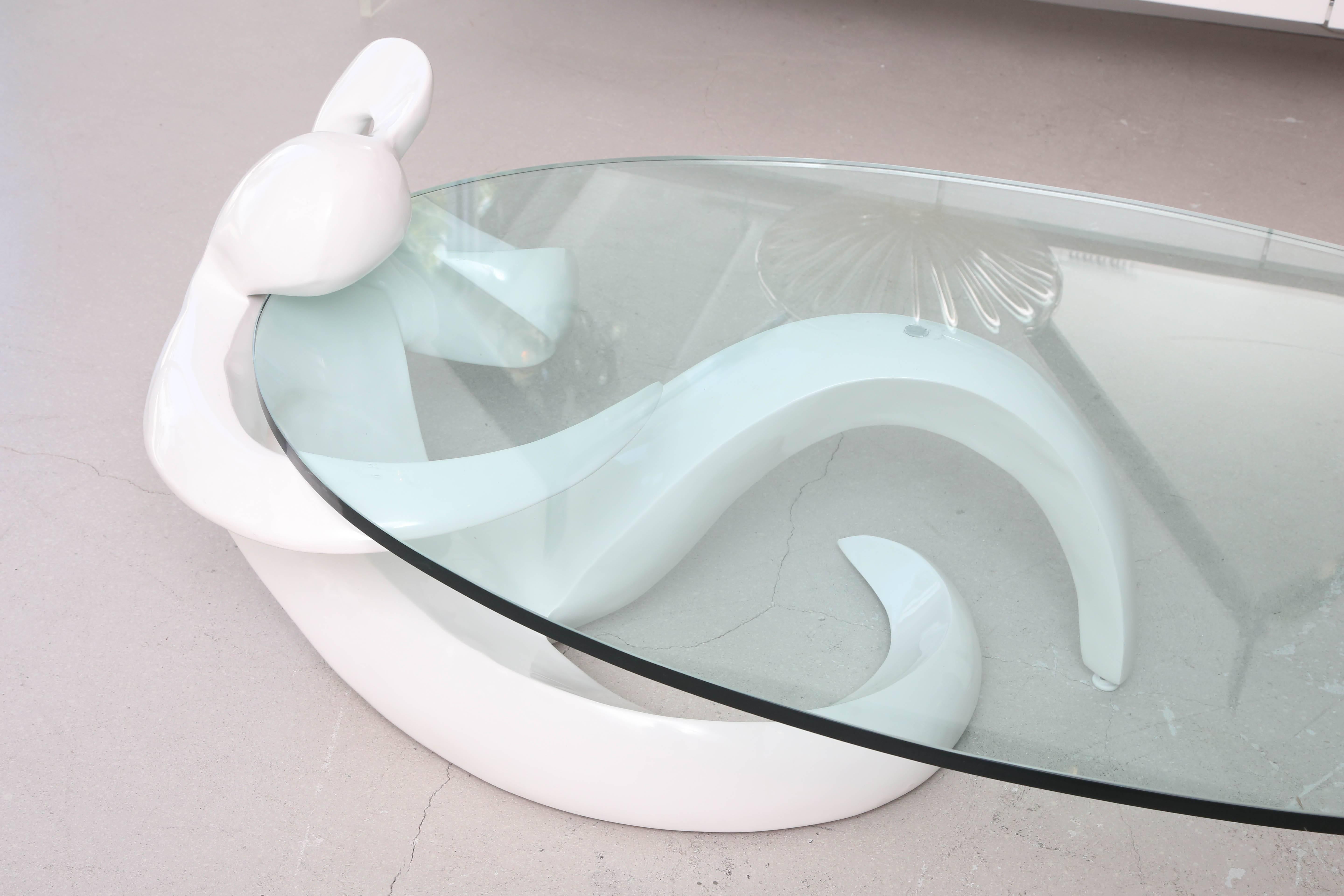White lacquered figural coffee table with oval cantilevered glass top, American, 1960s.