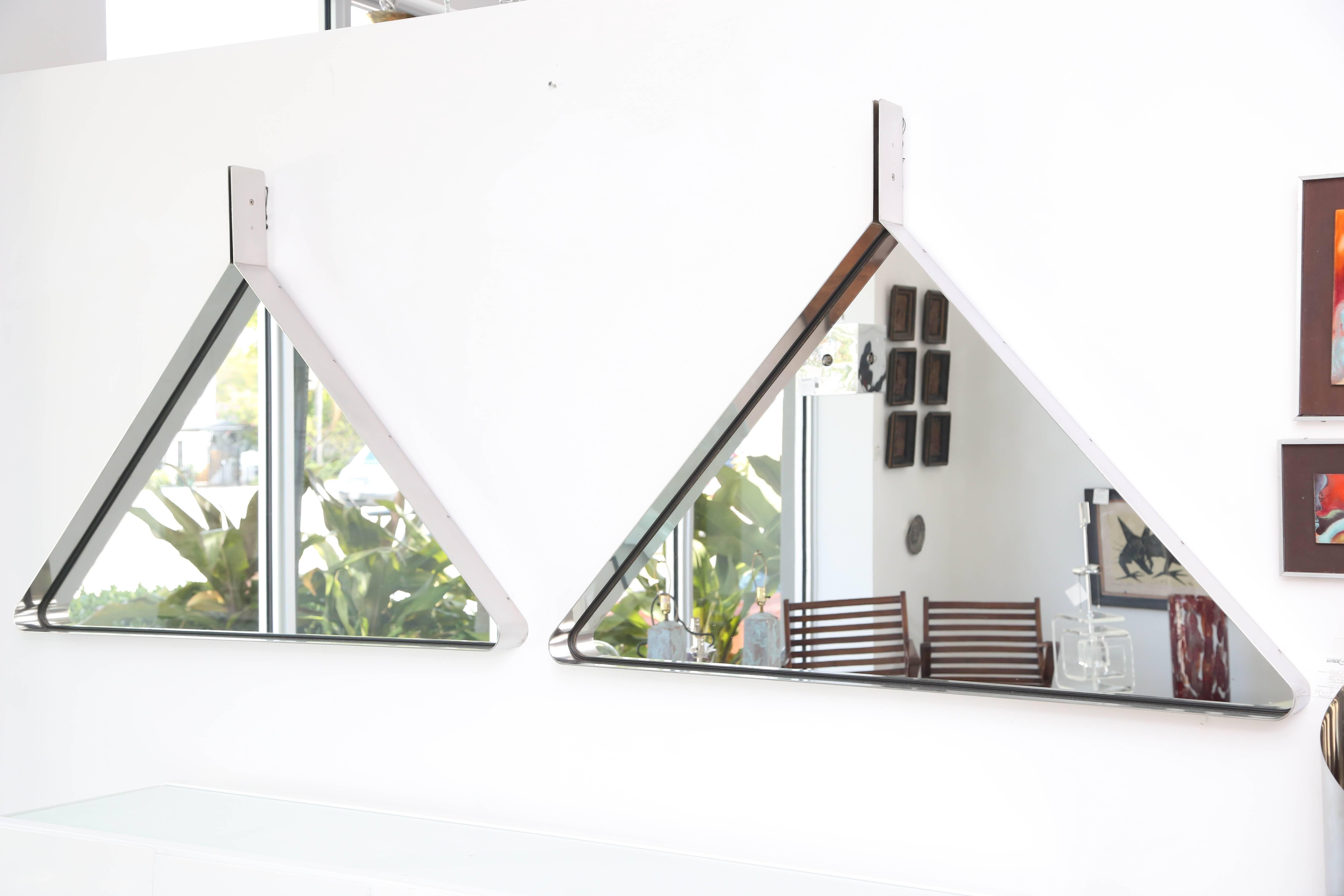 Pair of sleek polished triangular steel mirrors in the manner of Willy Rizzo 

Measures: 39 x 39 angles.