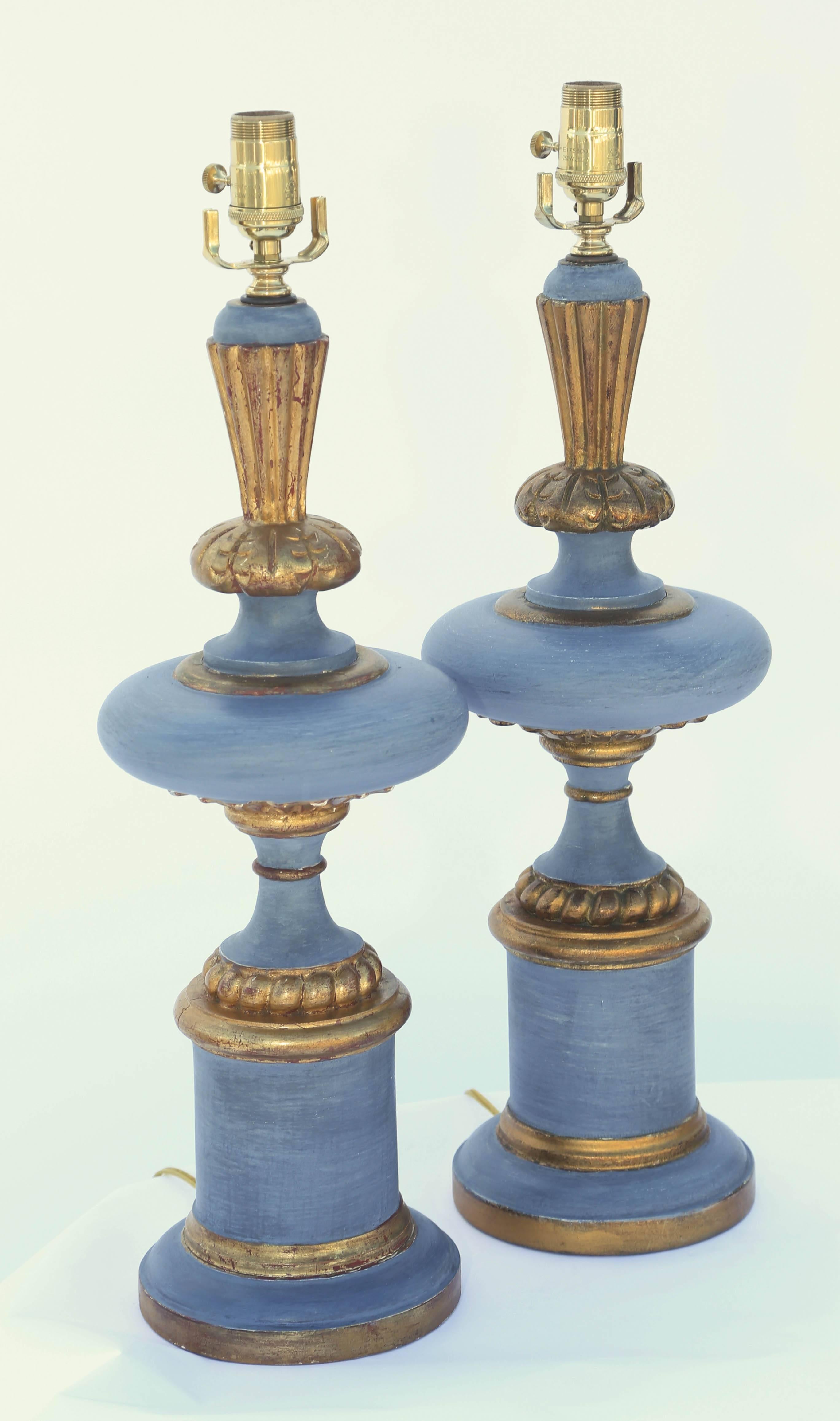 Pair of painted table lamps, with parcel-gilt accents, its turned, disk-form body surmounted by flared finial, on round foot and graduated plinth.

Stock ID: D9441
