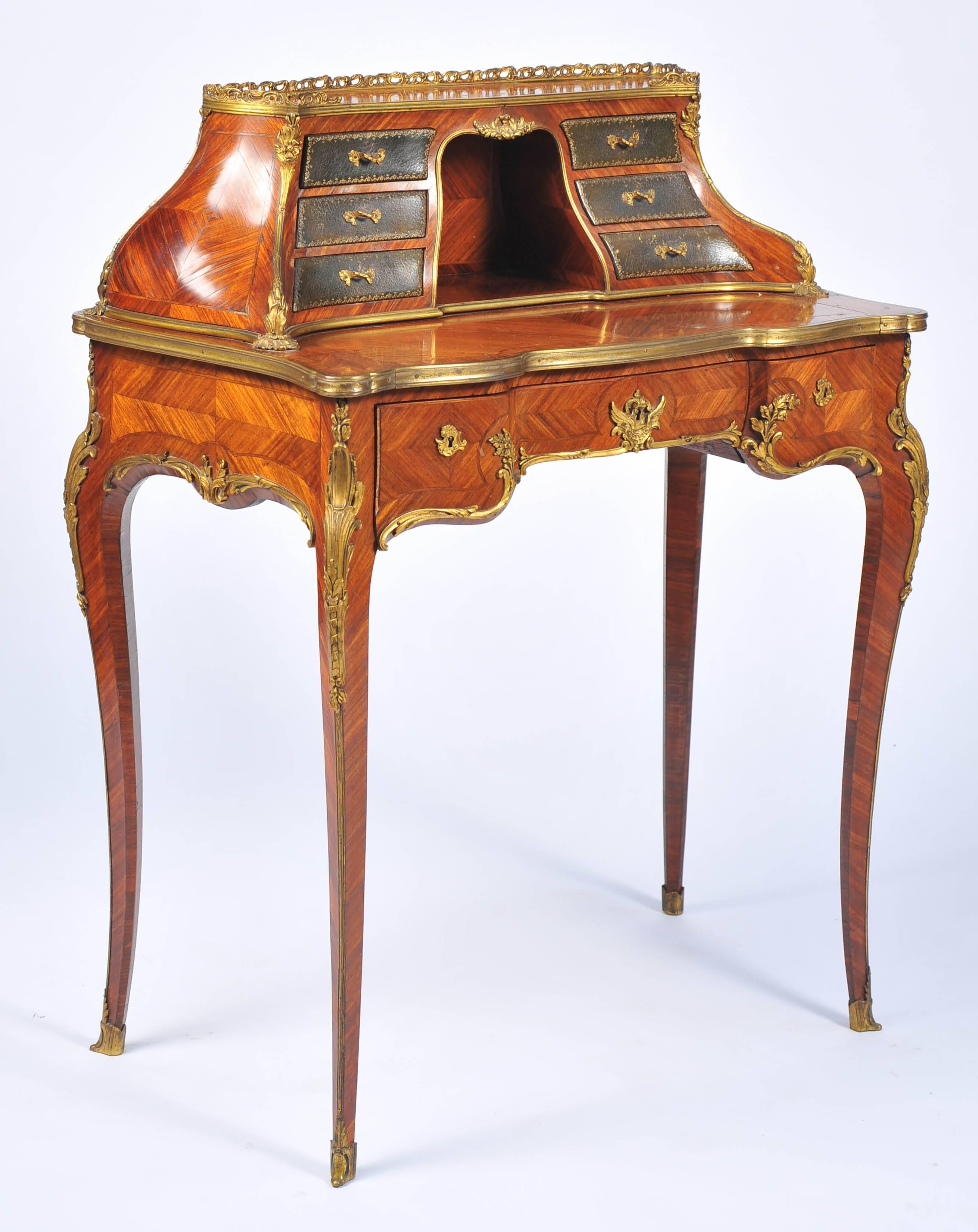 A very good quality Louis XV style French kingwood, ormolu-mounted bureau de-dame. Having six leather fronted drawers to the top, bombe sided. Three frieze drawers, raised on elegant cabriole legs, terminating in scrolled ormolu feet.