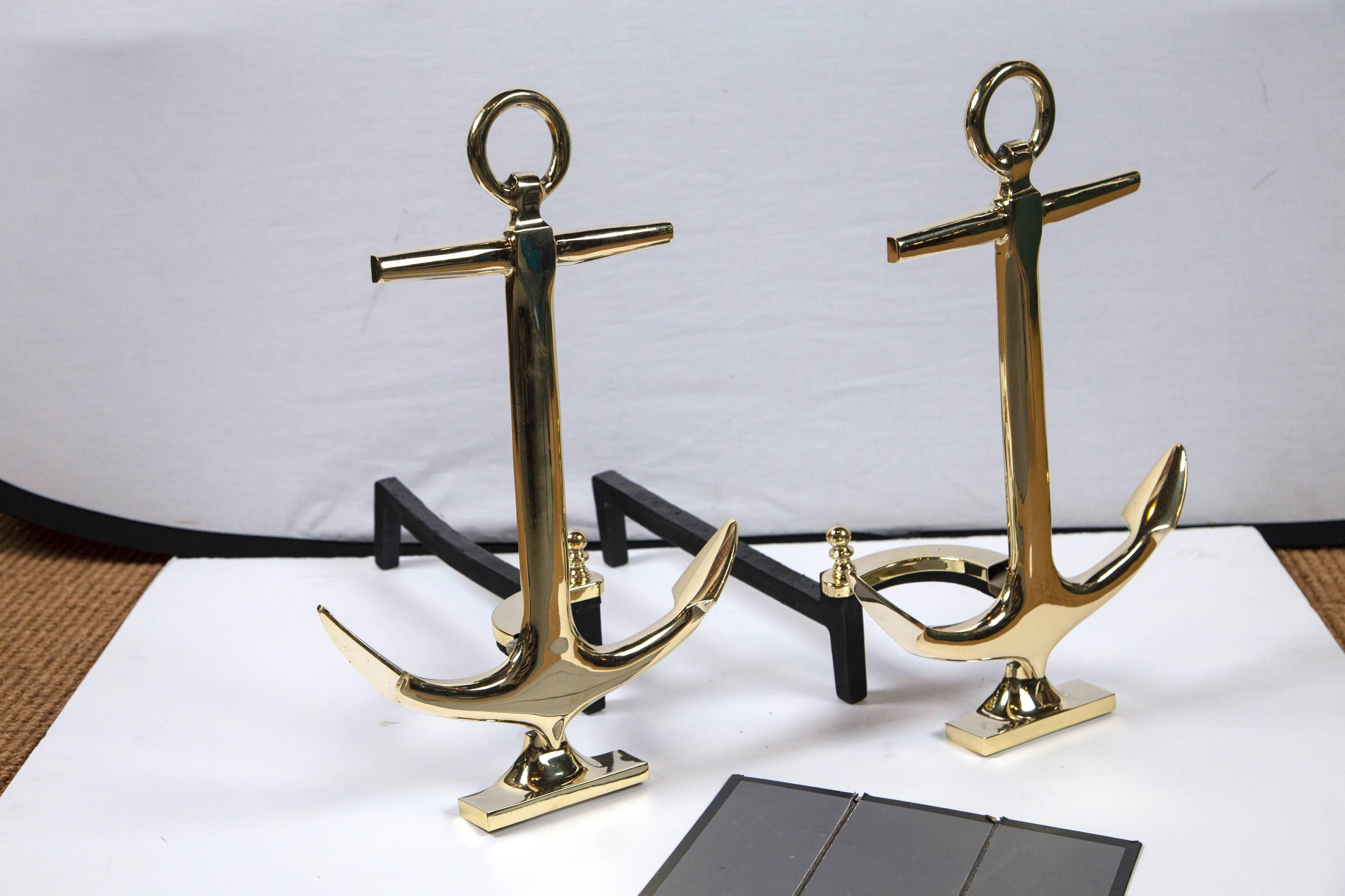 Pair of brass anchor andirons, mid-20th century. Decorative nautical design.