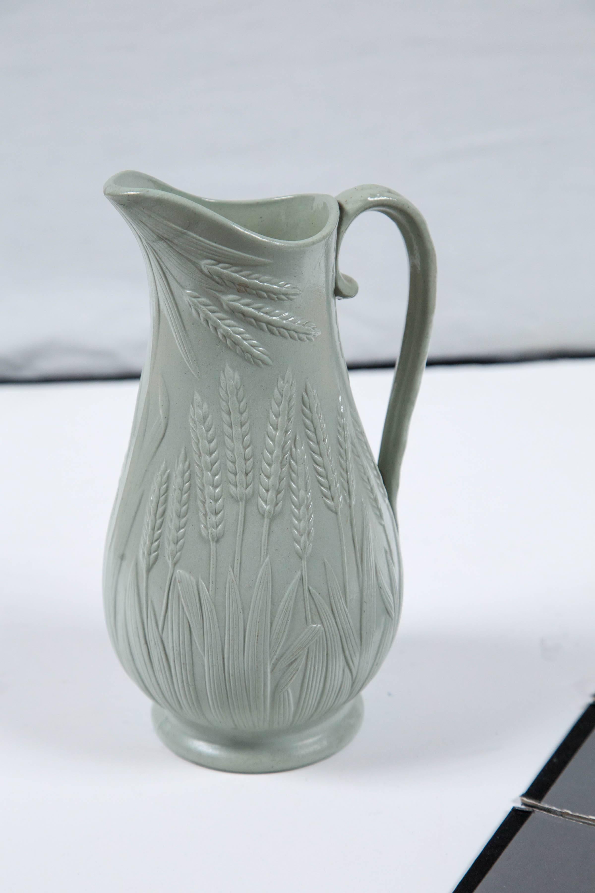 Antique salt glaze stoneware pitcher, circa 1860, Staffordshire, England. Raised relief 'wheat' pattern. Beautiful pale blue and gray glaze, often referred to as 'drab ware.'.