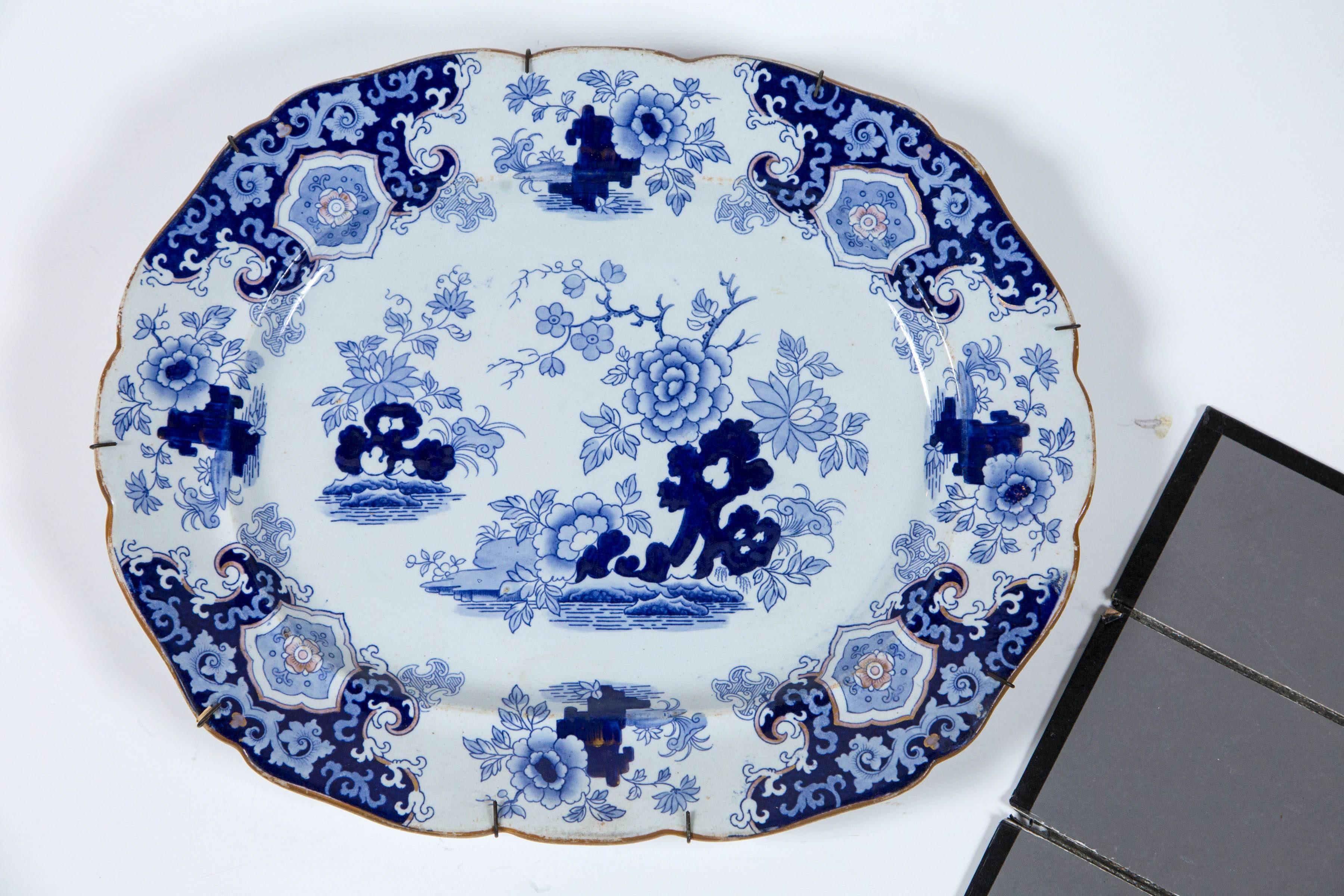 Chinoiserie ironstone platter, Ridgway & Morley, England, circa 1845. A beautifully articulated transferware design with shades of blue, and gold border and accents. Ridgeway & Morley was a major manufacturer in Staffordshire, England. Retains an