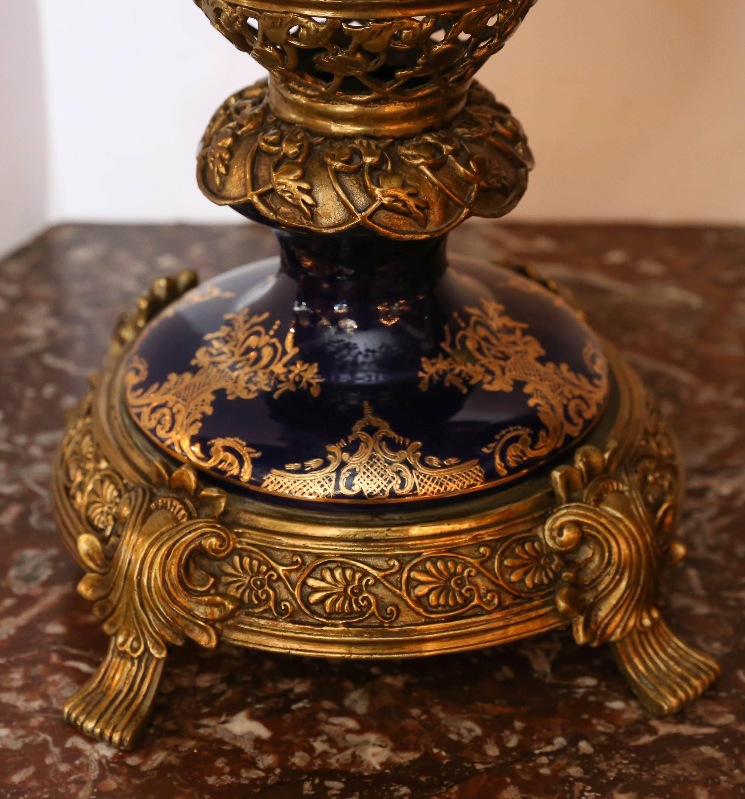 French Pair of Large Porcelain Lidded Urns, Bronze Mounted and Gilt Decorated