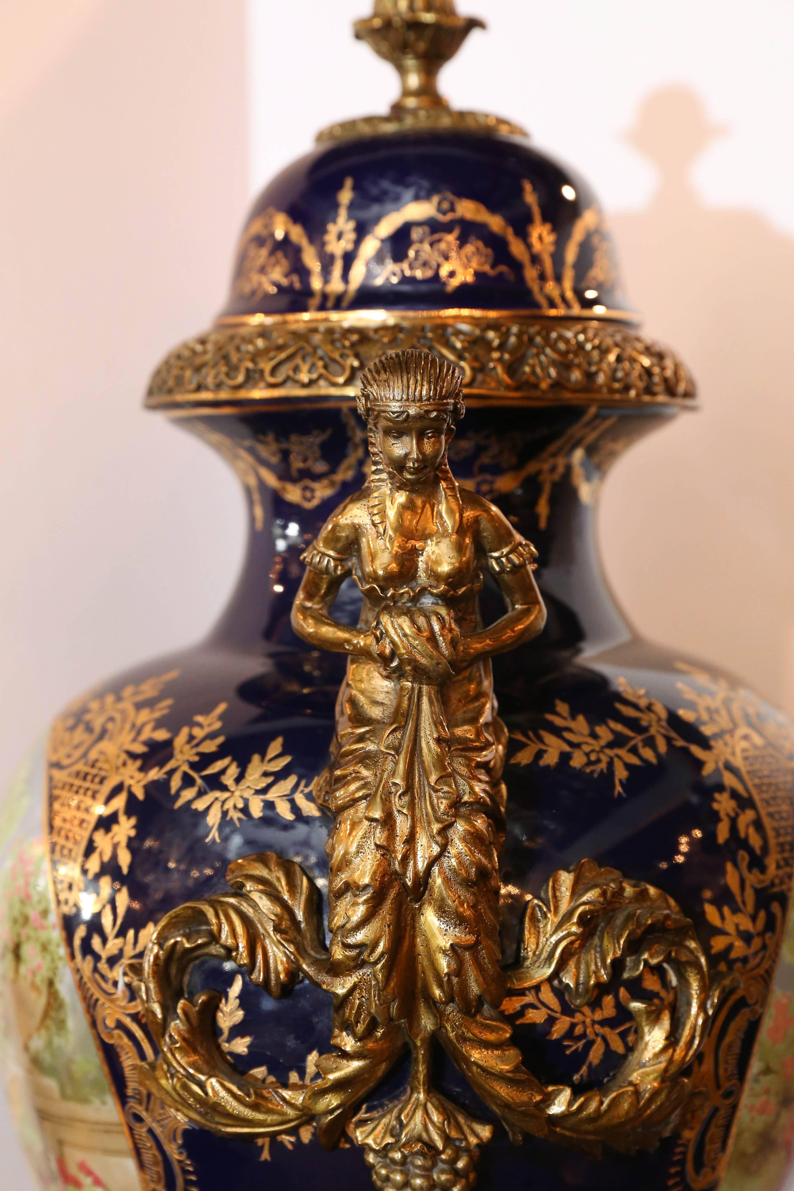 20th Century Pair of Large Porcelain Lidded Urns, Bronze Mounted and Gilt Decorated