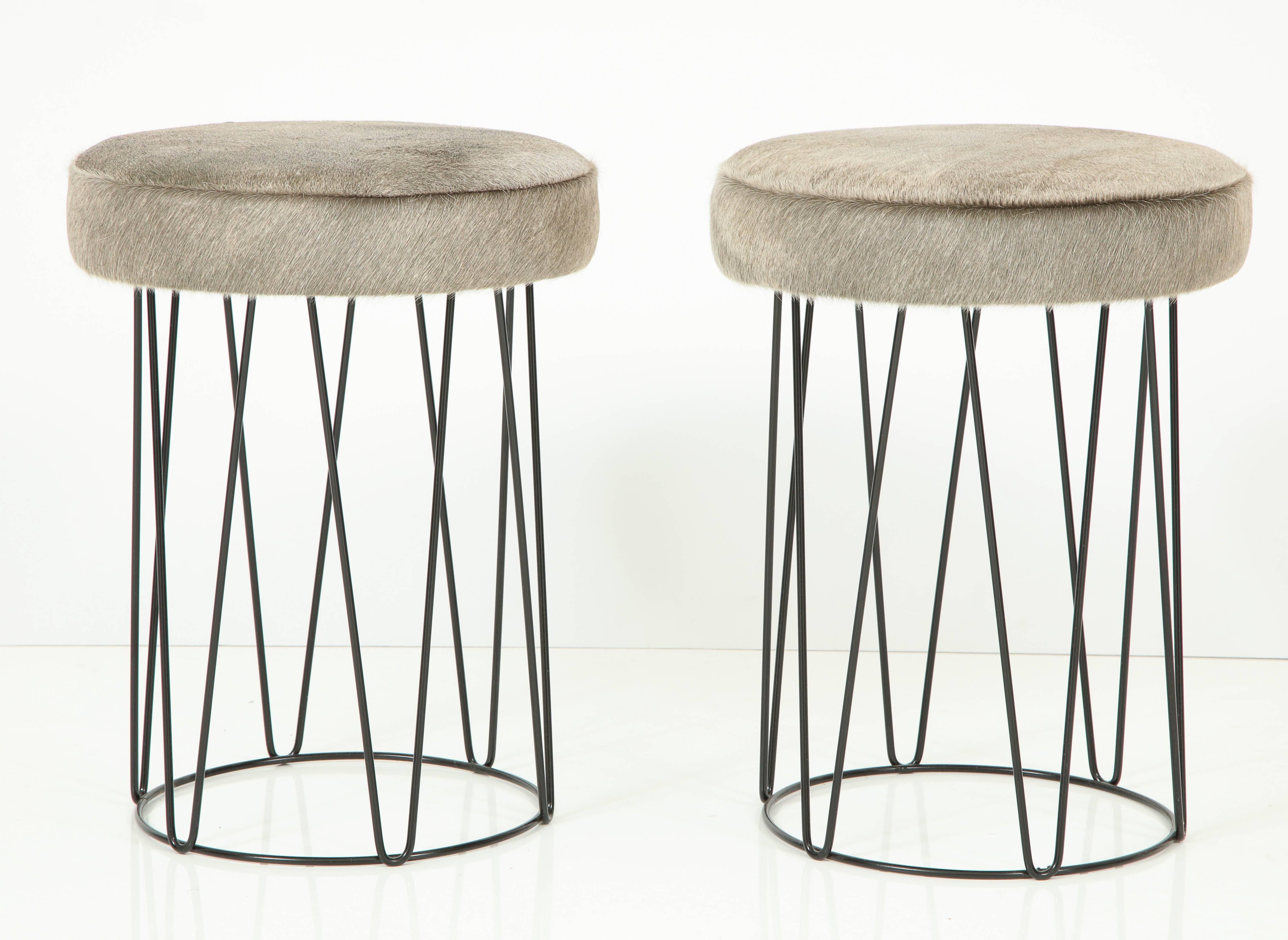 Stylized drum in wrought iron with Maharam tuft leather upholstery.
