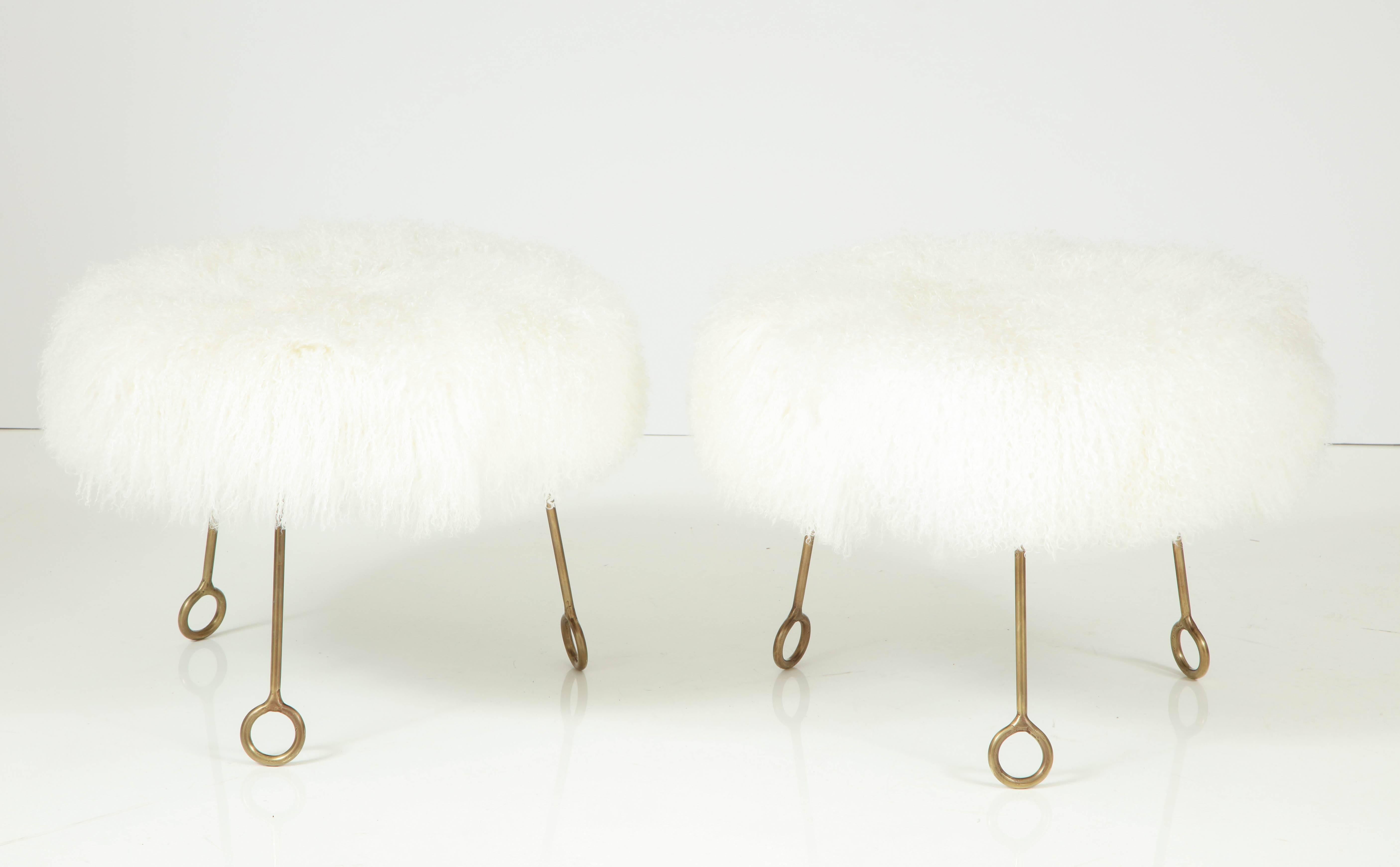 Gorgeous pair of Jean Royère attributed Yoyo stools in brass and sheep skin.