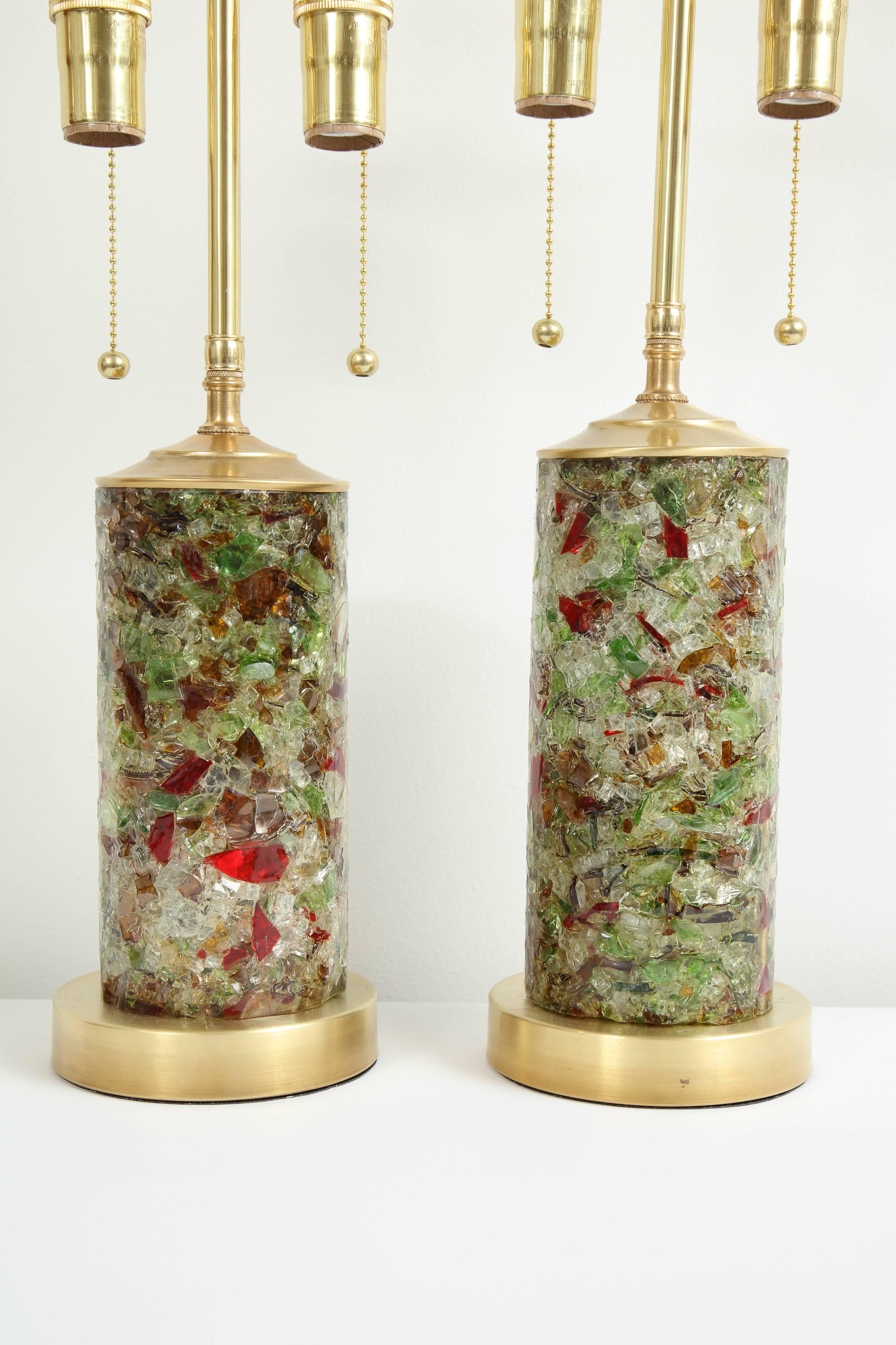 Wonderful pair of 1960s French Resin lamps.
The lamp bodies are handmade and therefore are very slightly different in size. They are made of compressed fractured pieces of green, red and clear fragments which are embedded in to the resin and sit on