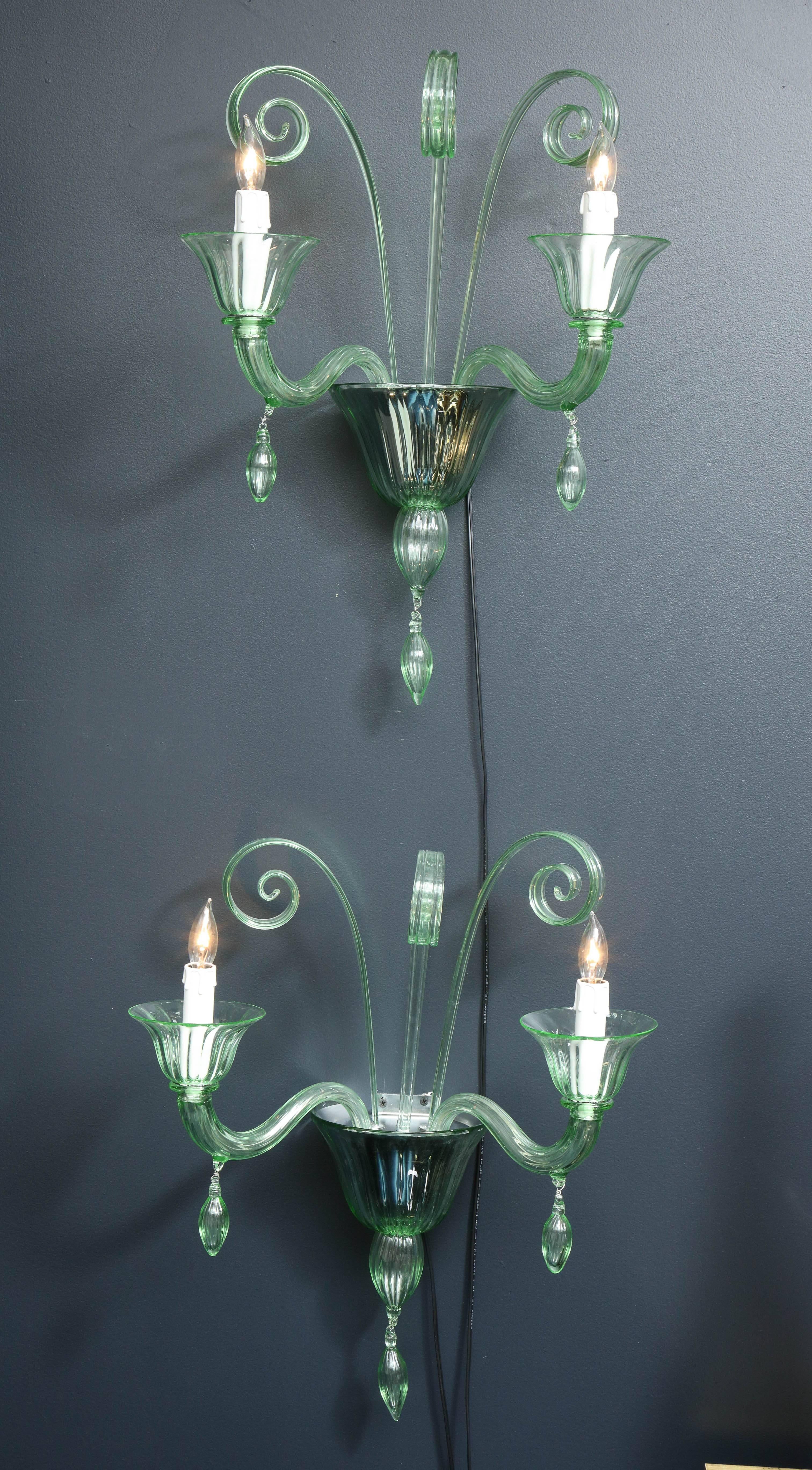 Clear, green infused Murano glass sconces with ribbed glass texture, curved glass details and glass drops. A classic design in a unique color. Rewired for the US. Chrome frame.